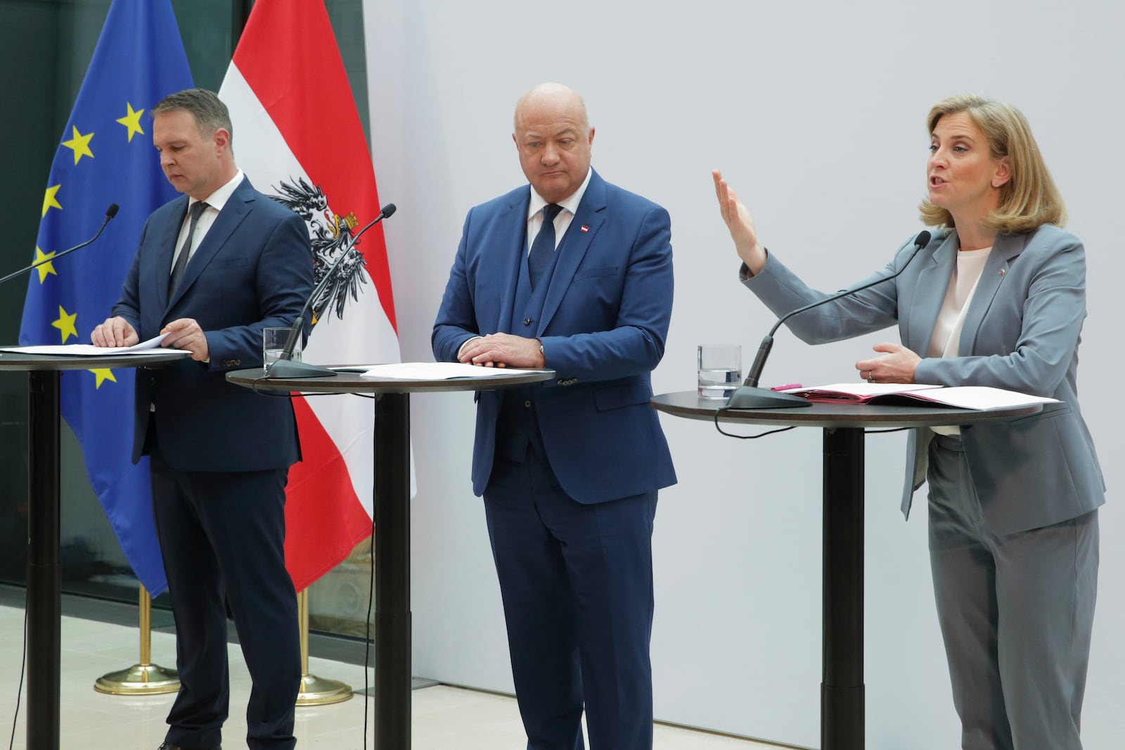 Austrian party leaders Christian Stocker of the Peoples' Party (OeVP), center, Andreas Babler of the Social Democrats (SPOe), left, and Beate Meinl-Reisinger of NEOS, right, address a news conference after agreeing to form a coalition government in Vienna, Austria, Thursday, Feb 27, 2025. (AP Photo/Heinz-Peter Bader)