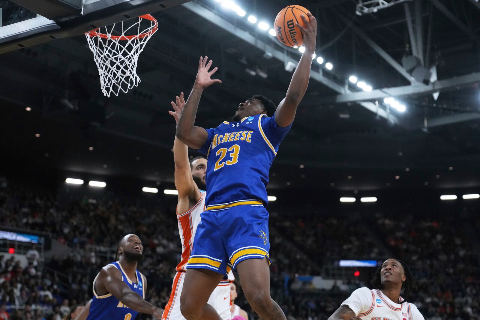 McNeese State guard Brandon Murray (23) drives to the basket against Clemson during the first half in the first round of the NCAA college basketball tournament, Thursday, March 20, 2025, in Providence, R.I. (AP Photo/Charles Krupa)