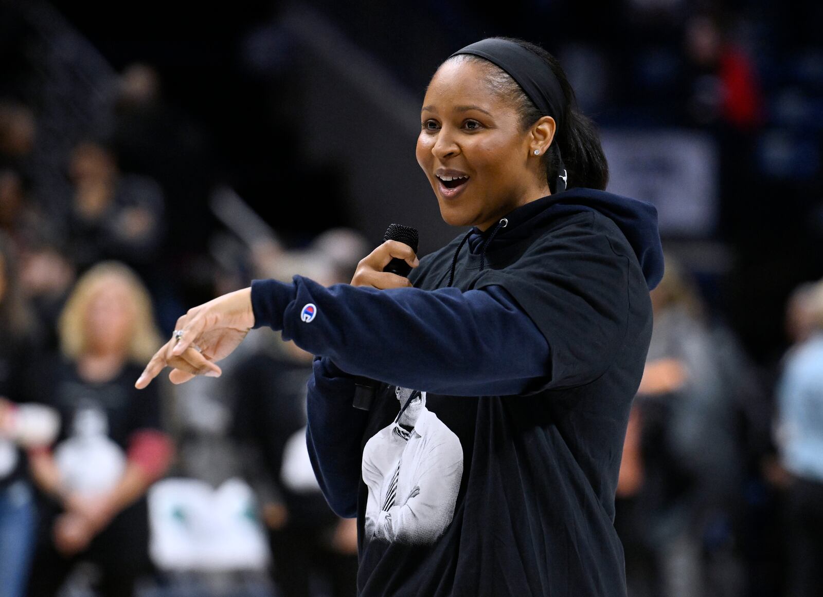 Former UConn player Maya Moore Irons addresses the audience and UConn head coach Geno Auriemma during a post game ceremony for the most wins in college basketball history, Wednesday, Nov. 20, 2024, in Storrs, Conn. (AP Photo/Jessica Hill)