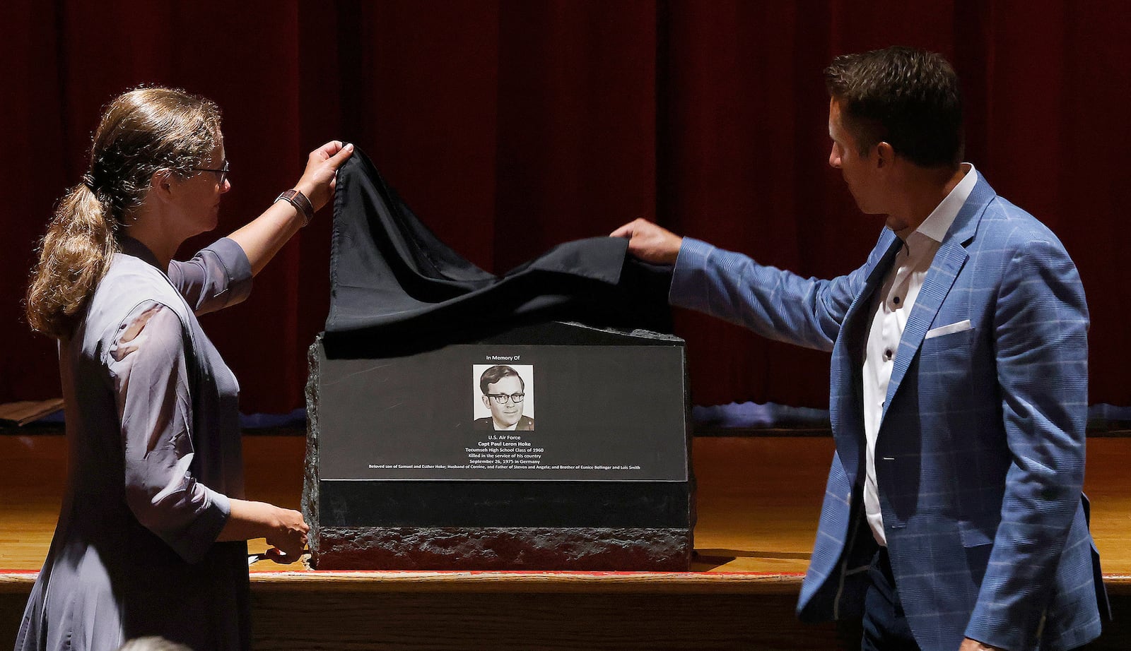 The children of Capt. Paul Leron Hoke, Angela Greenshields and Steven Hoke, unveil a marker Friday, Aug. 16, 2024 at Tecumseh High School in memory their father. Hoke, a 1960 graduate from Tecumseh, was killed serving his country Sept. 26, 1975 in Germany. MARSHALL GORBY\STAFF