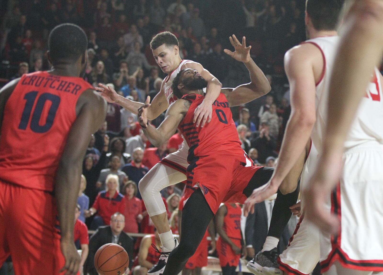 Davidson’s Kellan Grady fouls Dayton’s Josh Cunningham with 2.2 seconds to play on Tuesday, Feb. 19, 2019, at Belk Arena in Davidson, N.C. David Jablonski/Staff