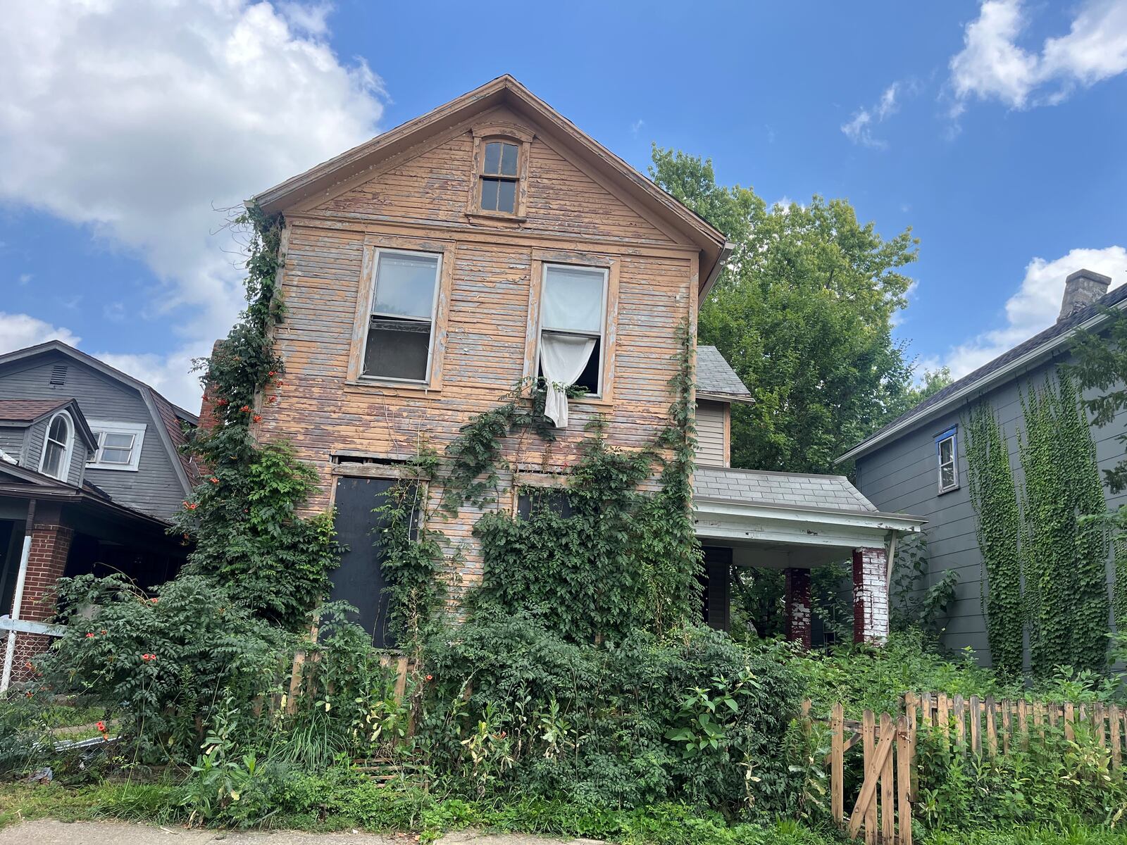 A blighted and abandoned home in East Dayton. CORNELIUS FROLIK / STAFF