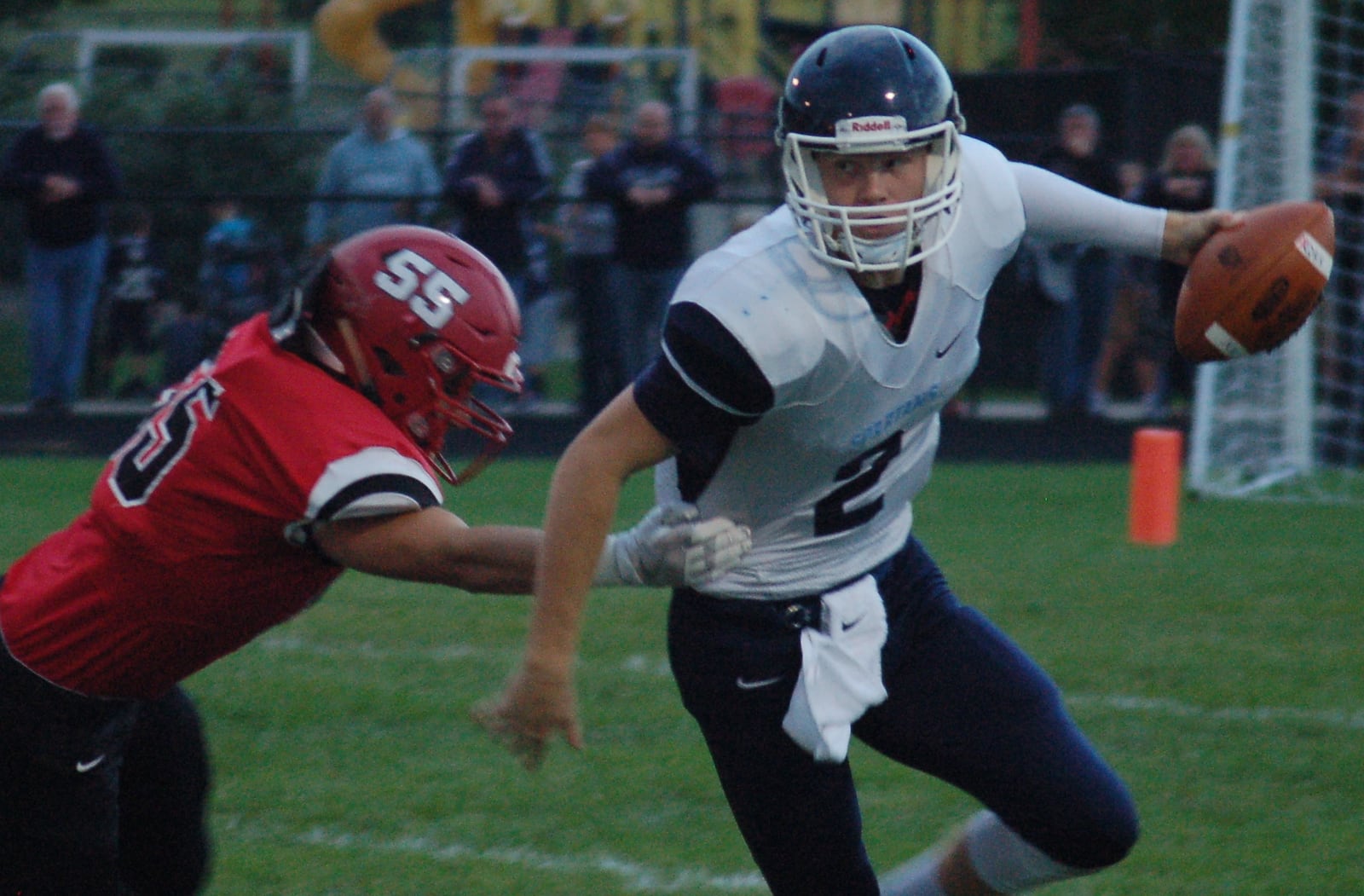 Valley View quarterback Collin Wood eludes the tackle of Madison’s Levi Wilson earlier this season at Madison High School. Valley View won 32-7. JOHN CUMMINGS / CONTRIBUTED