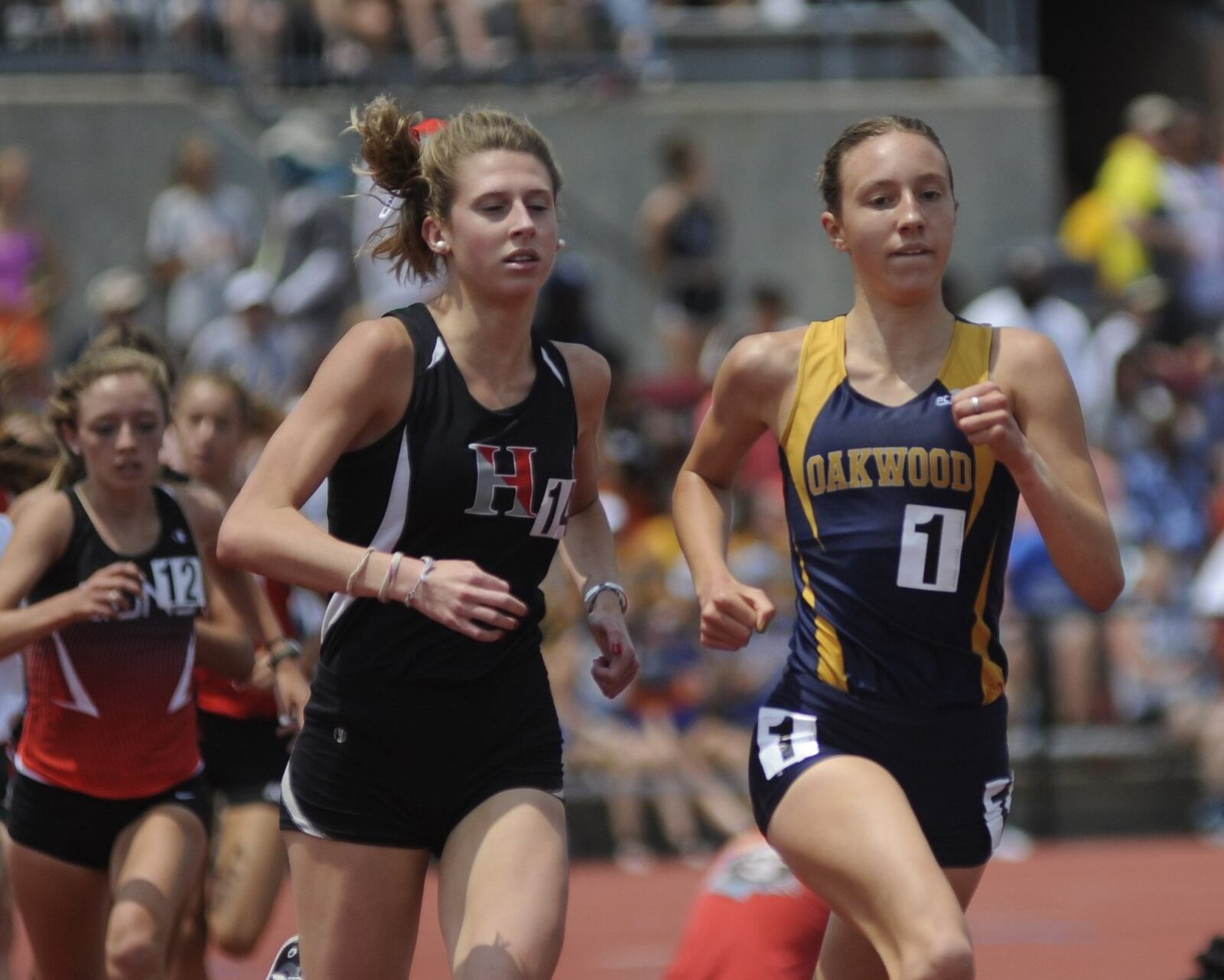 Oakwood freshman Grace Martman (right) was second in the 1,600 meters during the D-II state track and field meet at OSU’s Jesse Owens Memorial Stadium at Columbus on Saturday, June 1, 2019. MARC PENDLETON / STAFF