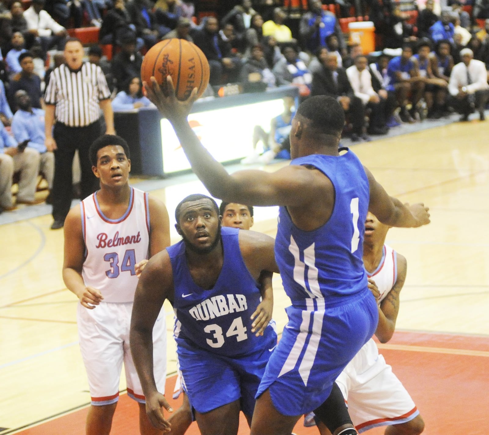 Dunbar’s Tavion Thomas (with ball) looks for teammate Jonathan Allen (34). Dunbar defeated host Belmont 58-57 in a boys high school basketball game on Fri., Jan. 26, 2018. MARC PENDLETON / STAFF