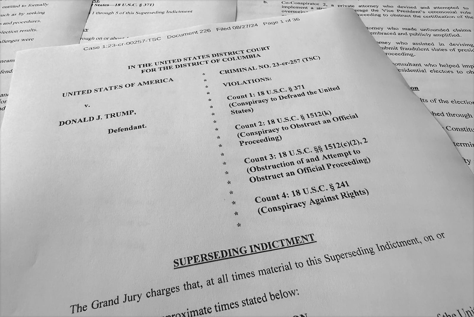 FILE - The superseding indictment against former President Donald Trump is photographed Tuesday, Aug. 27, 2024, after special counsel Jack Smith filed the new indictment against Trump that keeps the same criminal charges but narrows the allegations against him following a Supreme Court opinion conferring broad immunity on former presidents. (AP Photo/Jon Elswick, File)