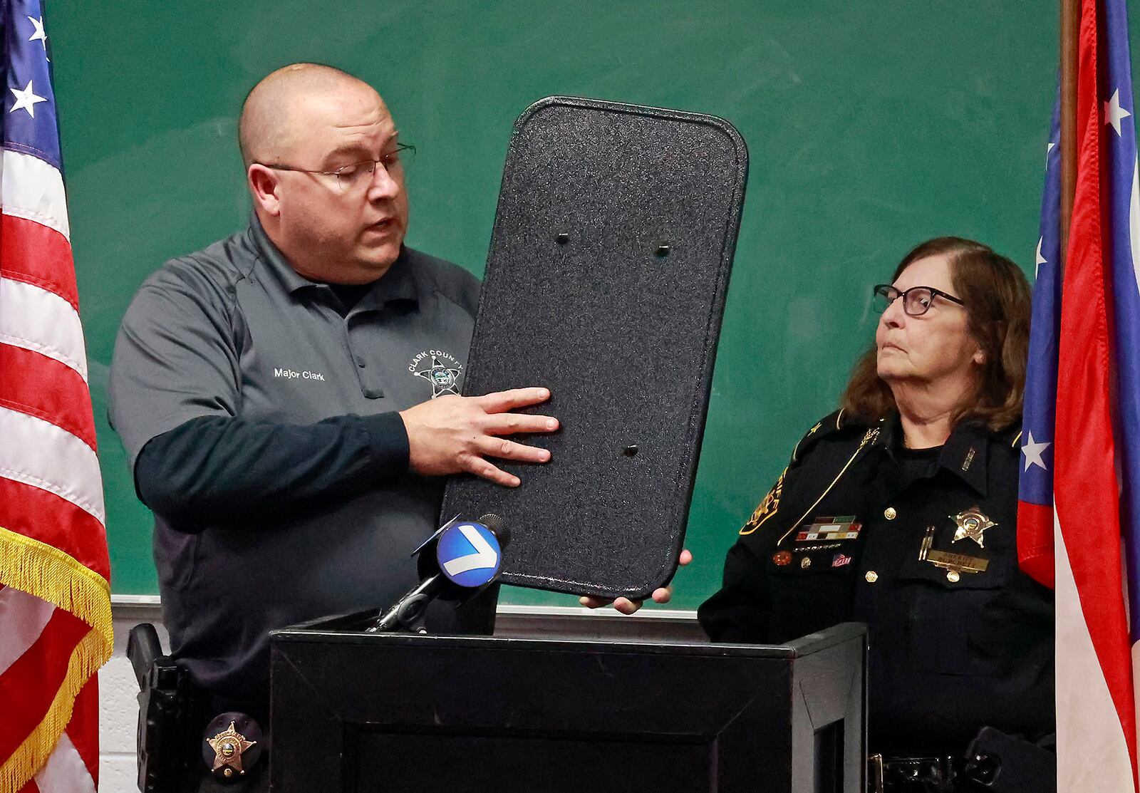 Clark County Sheriff Deb Burchett and Major Chris Clark talk about the new ballistic shields they were able to supply to every member of their department thanks to a fund raiser at Brandeberry Winery in Enon.  BILL LACKEY/STAFF