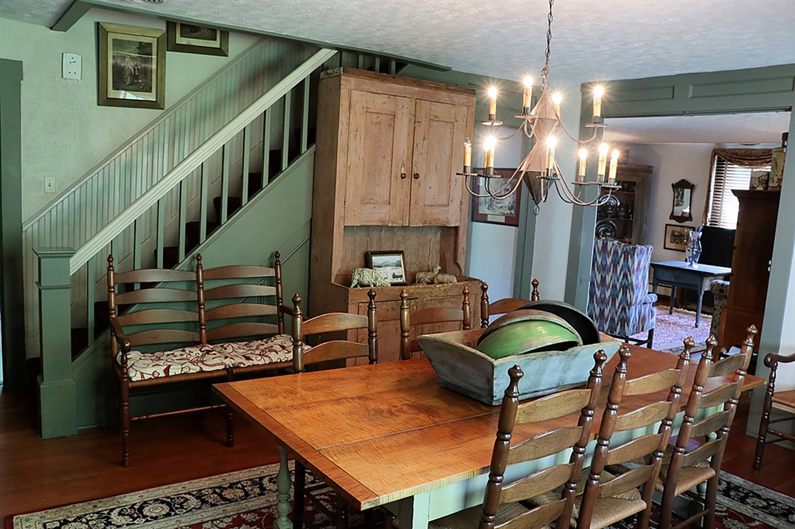 Hardwood flooring throughout has been refinished and flows from the living room into the kitchen and formal dining room as the three rooms encircle the staircase to the upstairs. CONTRIBUTED PHOTO BY KATHY TYLER