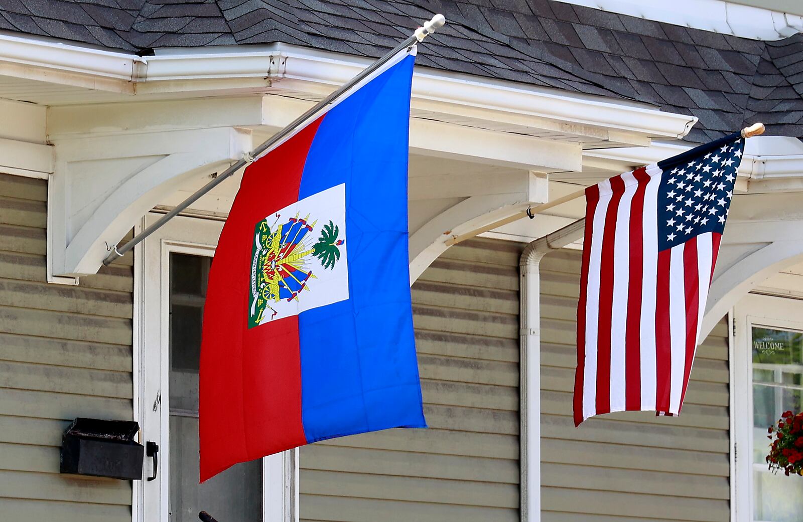 A residence along North Limestone Street in Springfield was flying the Haitian flag along side the American flag Wednesday, May 10, 2023. BILL LACKEY/STAFF