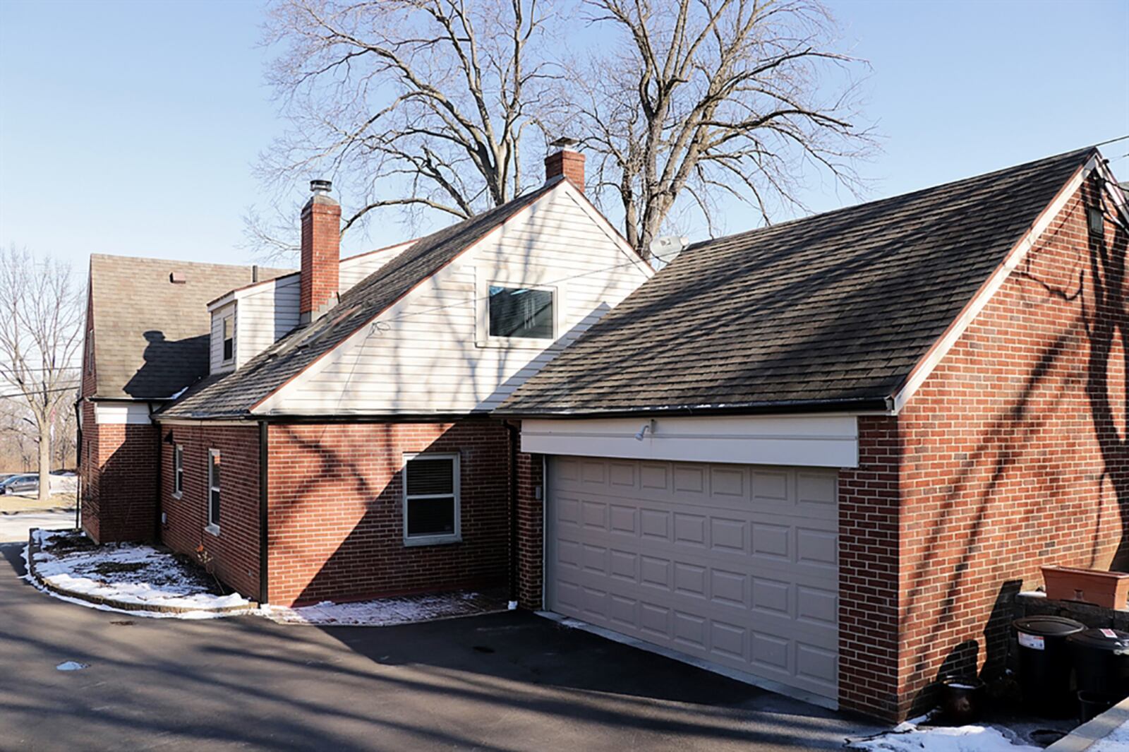 The property includes a long, paved driveway that has extra parking space and ends at the side-entry, 2-car garage. CONTRIBUTED PHOTO BY KATHY TYLER