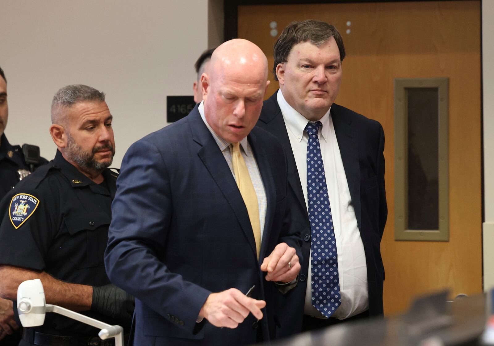 Rex A. Heuermann stands with his lawyer Michael Brown during a court hearing where he was charged with killing Valerie Mack, inside Supreme Court Justice Timothy Mazzei's courtroom at Suffolk County Court in Riverhead, N.Y. on Tuesday, Dec. 17, 2024. (James Carbone/Newsday via AP, Pool)