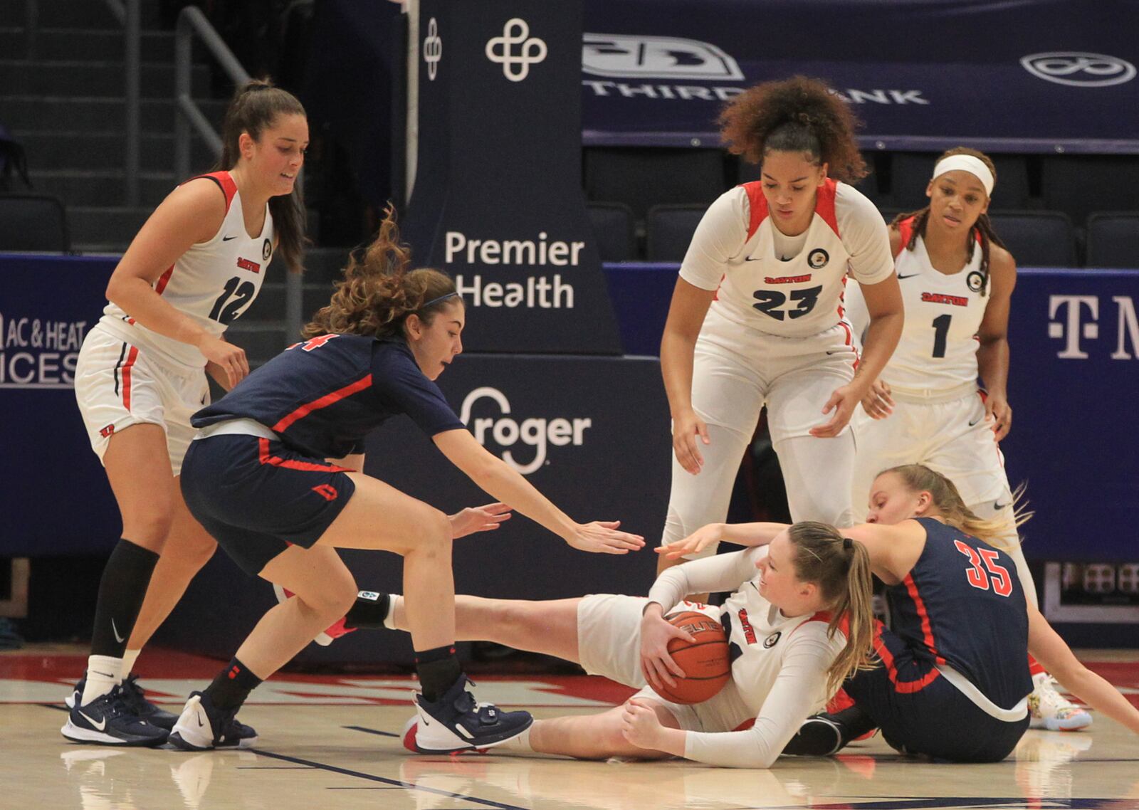 Dayton's Erin Whalen competes for a loose ball against Duquesne on Sunday, Jan. 3, 2020, at UD Arena. David Jablonski/Staff