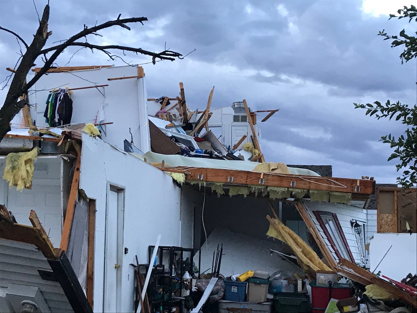 PHOTOS: Tornado-damaged communities dig out, clean up