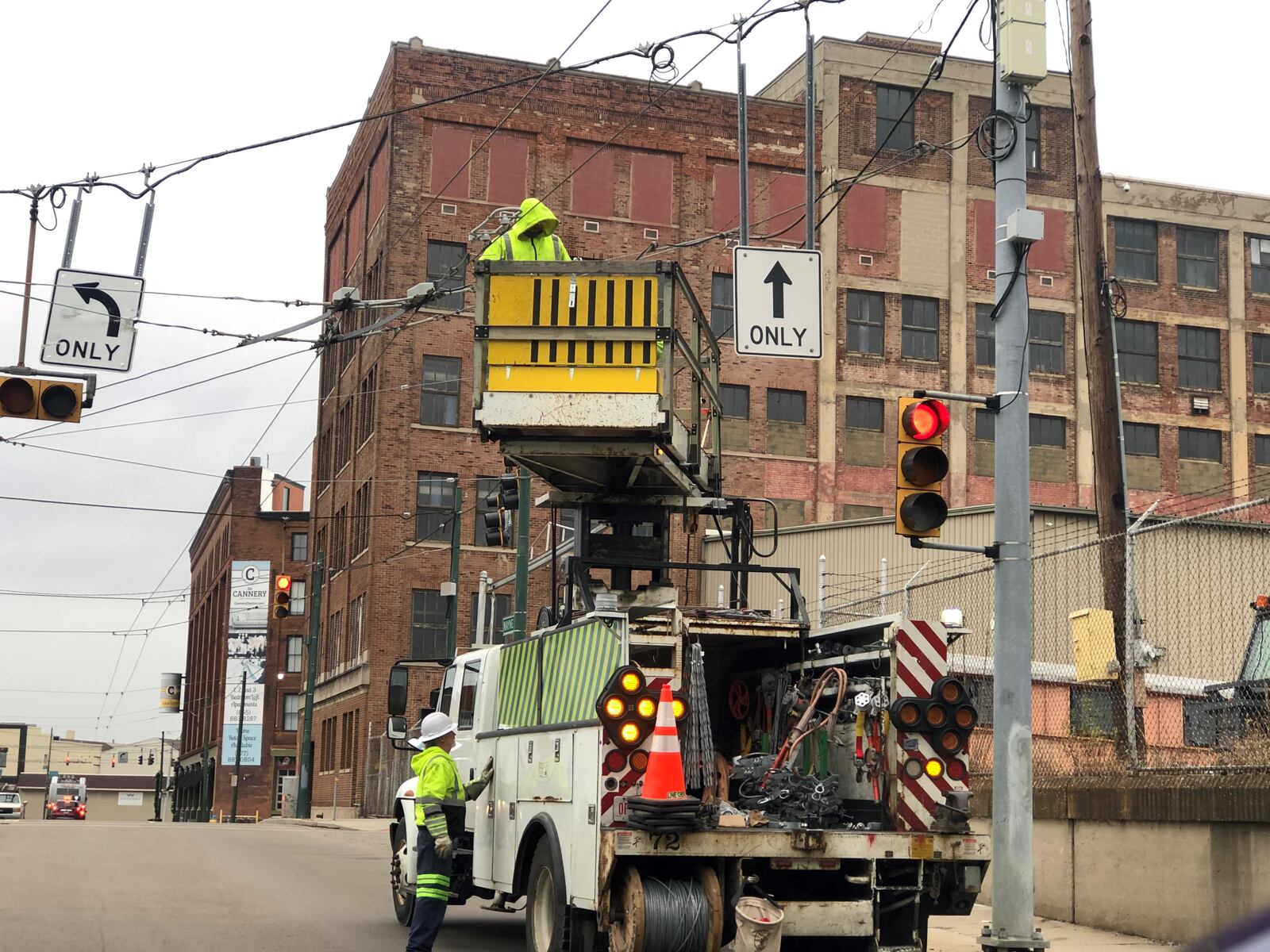 Greater Dayton Regional Transit Authority crews work on trolley bus lines near the Oregon District. The RTA is scheduled to remove the overhead trolley wire system in Oakwood, including along Far Hills Avenue. CORNELIUS FROLIK / STAFF