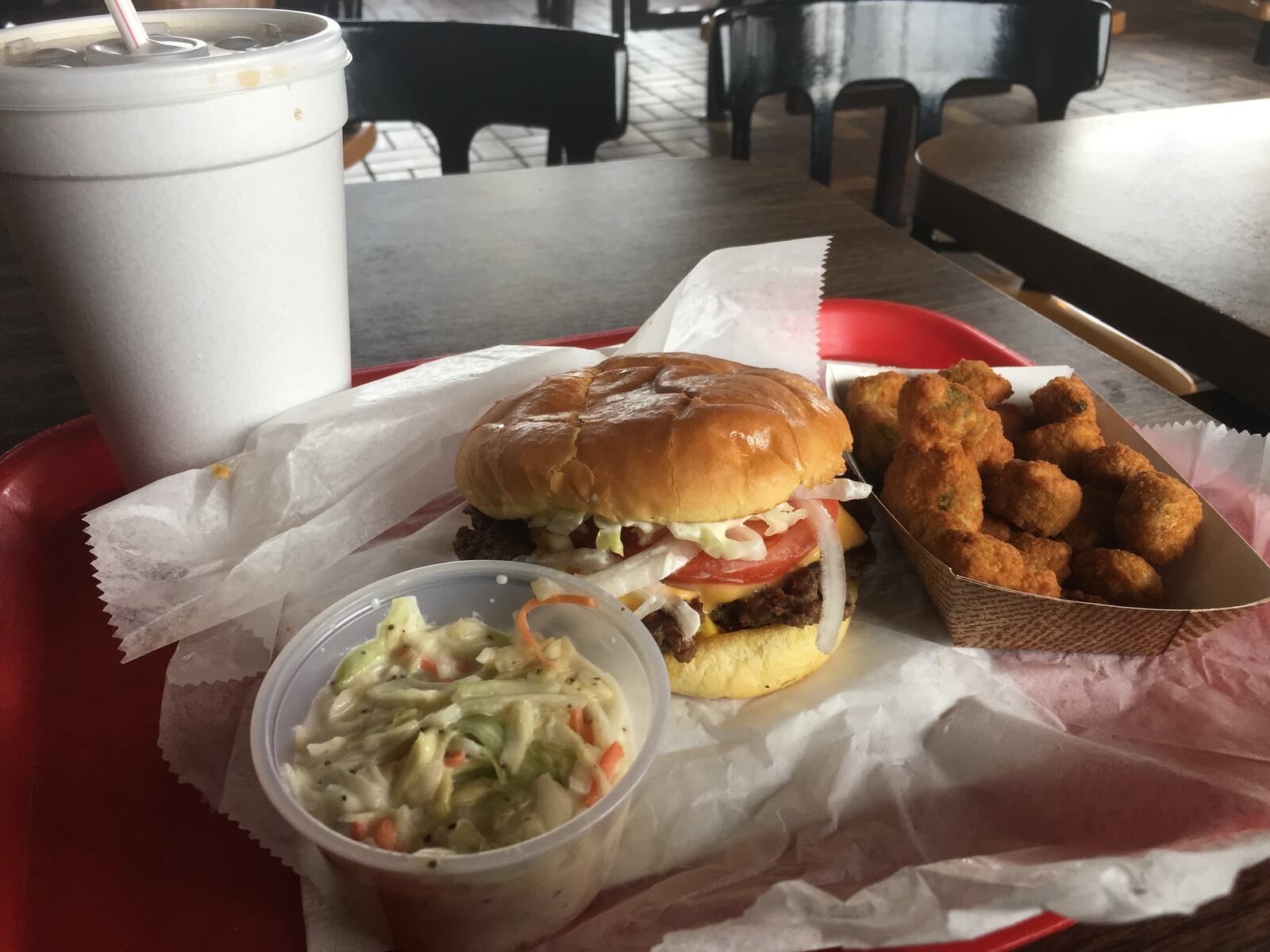 A cheeseburger, coleslaw and fried okra from Benjamin’s the Burger Master. ALEXIS LARSEN/CONTRIBUTED