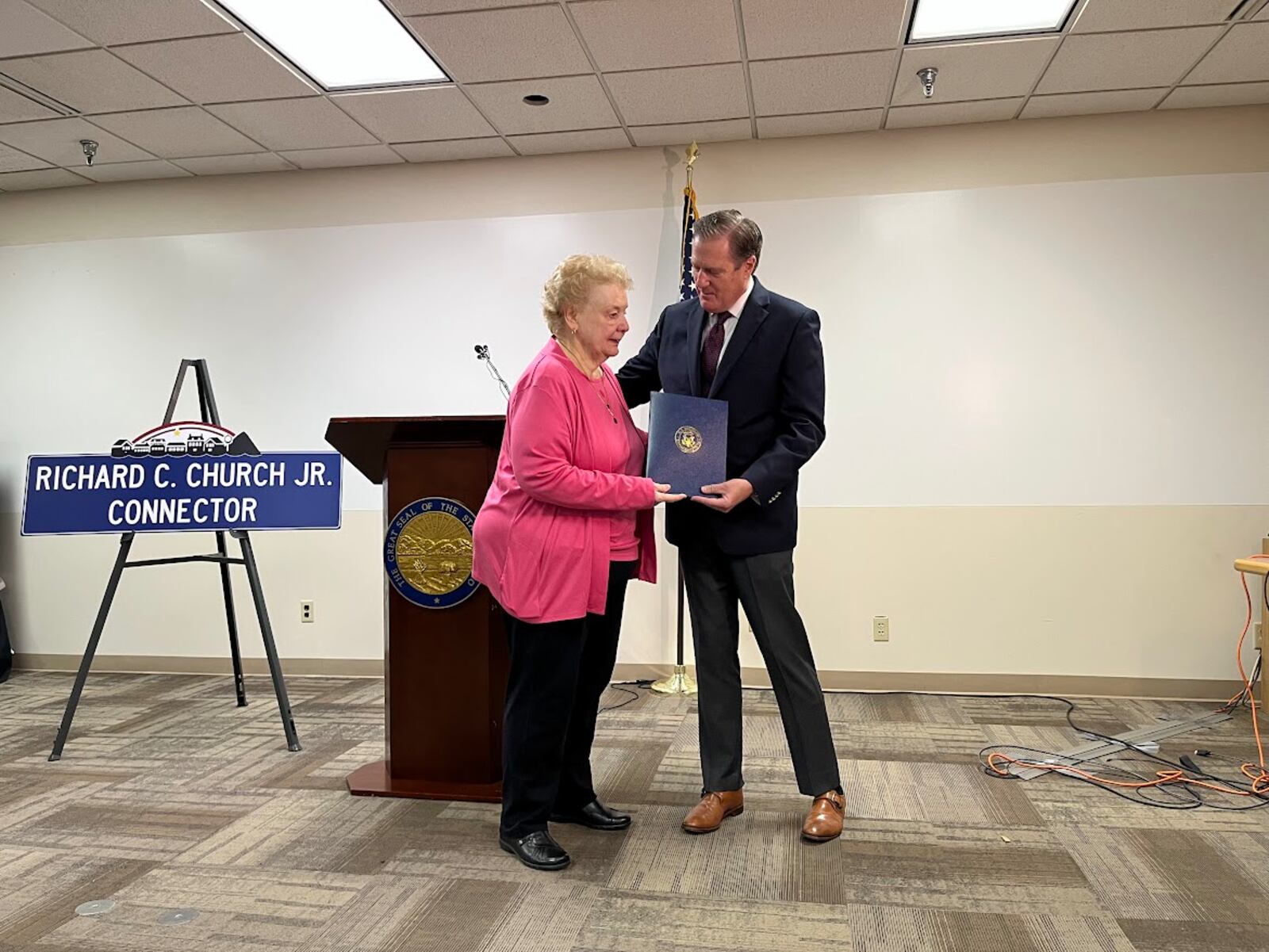 U.S. Rep. Mike Turner, R-Dayton, greets Judy Church Thursday at a press conference at the Mound Science and Energy Museum. Church was married to Miamisburg Mayor Richard Church Jr., the city's longest serving mayor, who died in 2022. THOMAS GNAU/STAFF