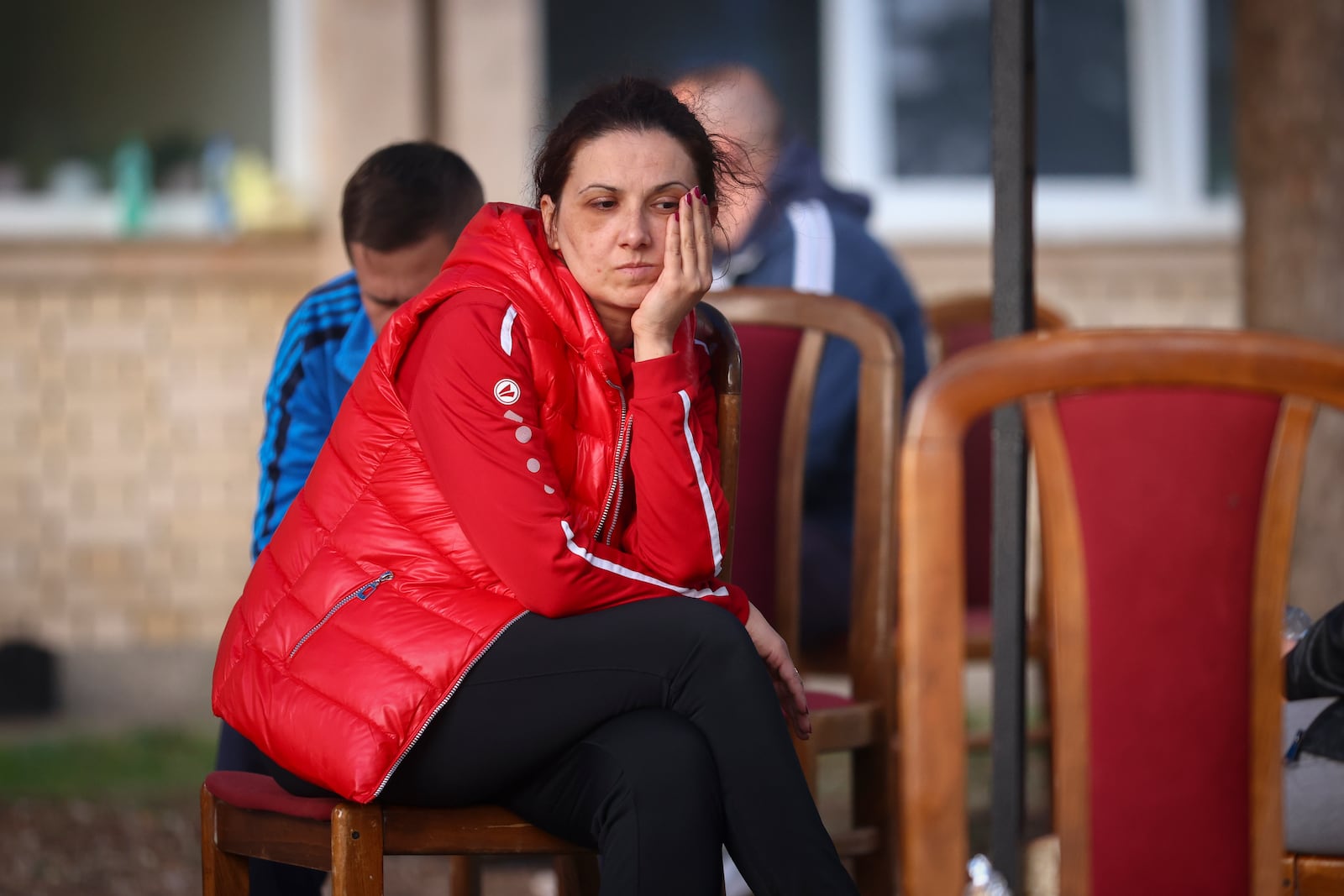 A woman waits outside a hospital in the town of Kocani, North Macedonia, Sunday, March 16, 2025, following a massive fire in a nightclub early Sunday. (AP Photo/Armin Durgut)