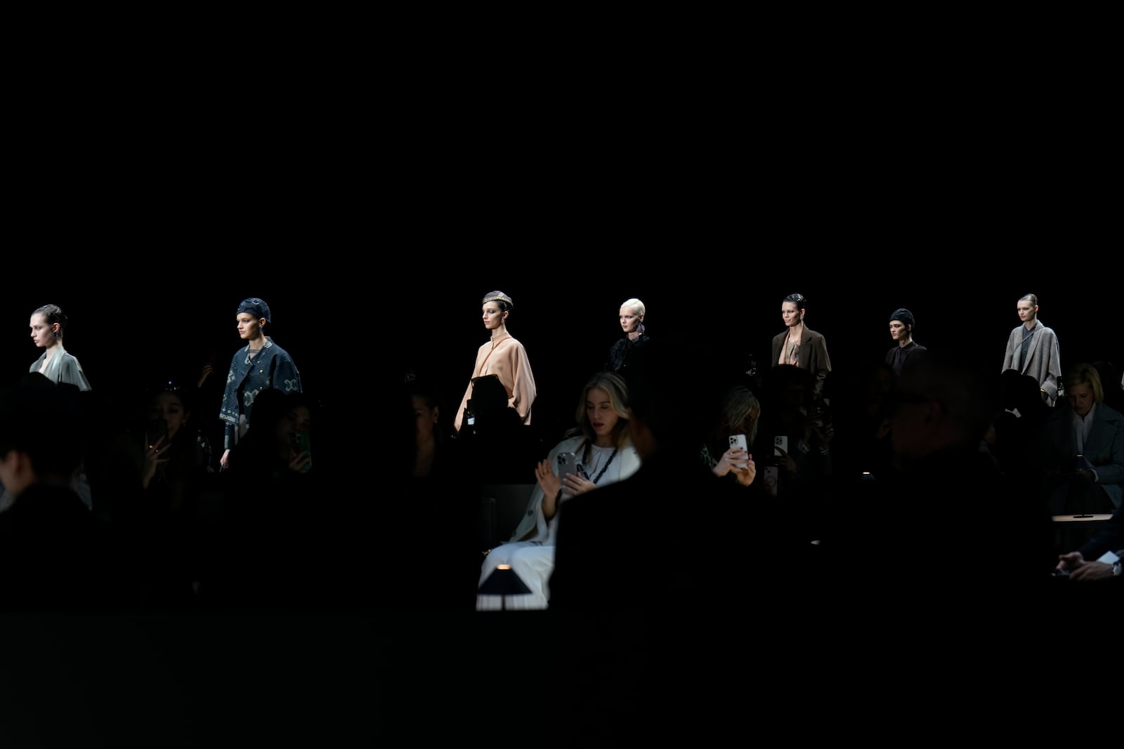 Models wear creations as part of the Giorgio Armani Fall/Winter 2025-2026 Women's collection presented in Milan, Italy, Sunday, March 2, 2025. (AP Photo/Luca Bruno)