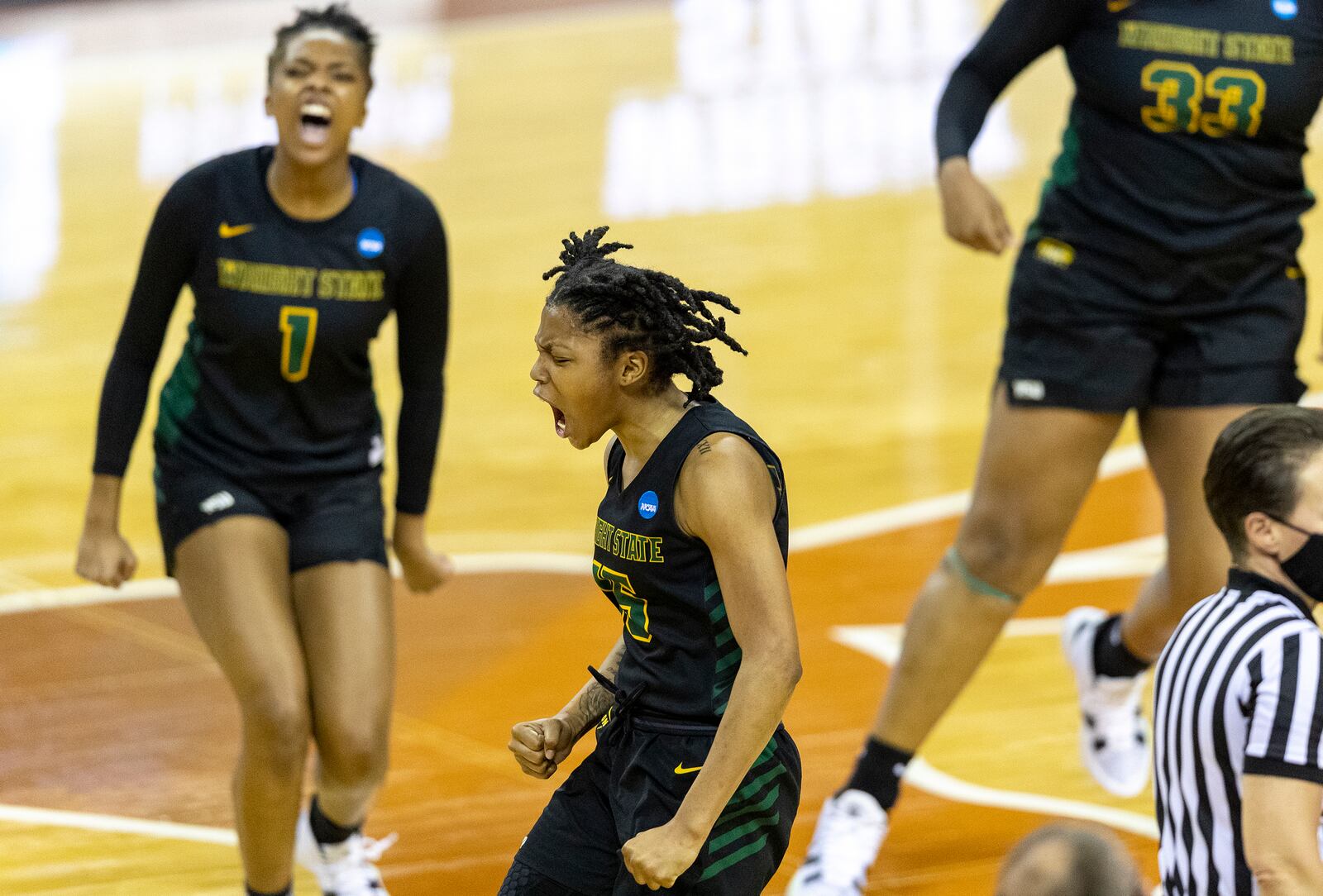 Wright State forward Alexis Stover (1) and guard Angel Baker celebrate scoring against Arkansas during the second half of a college basketball game in the first round of the women's NCAA tournament at the Frank Erwin Center in Austin, Texas, Monday, March 22, 2021. (AP Photo/Stephen Spillman)