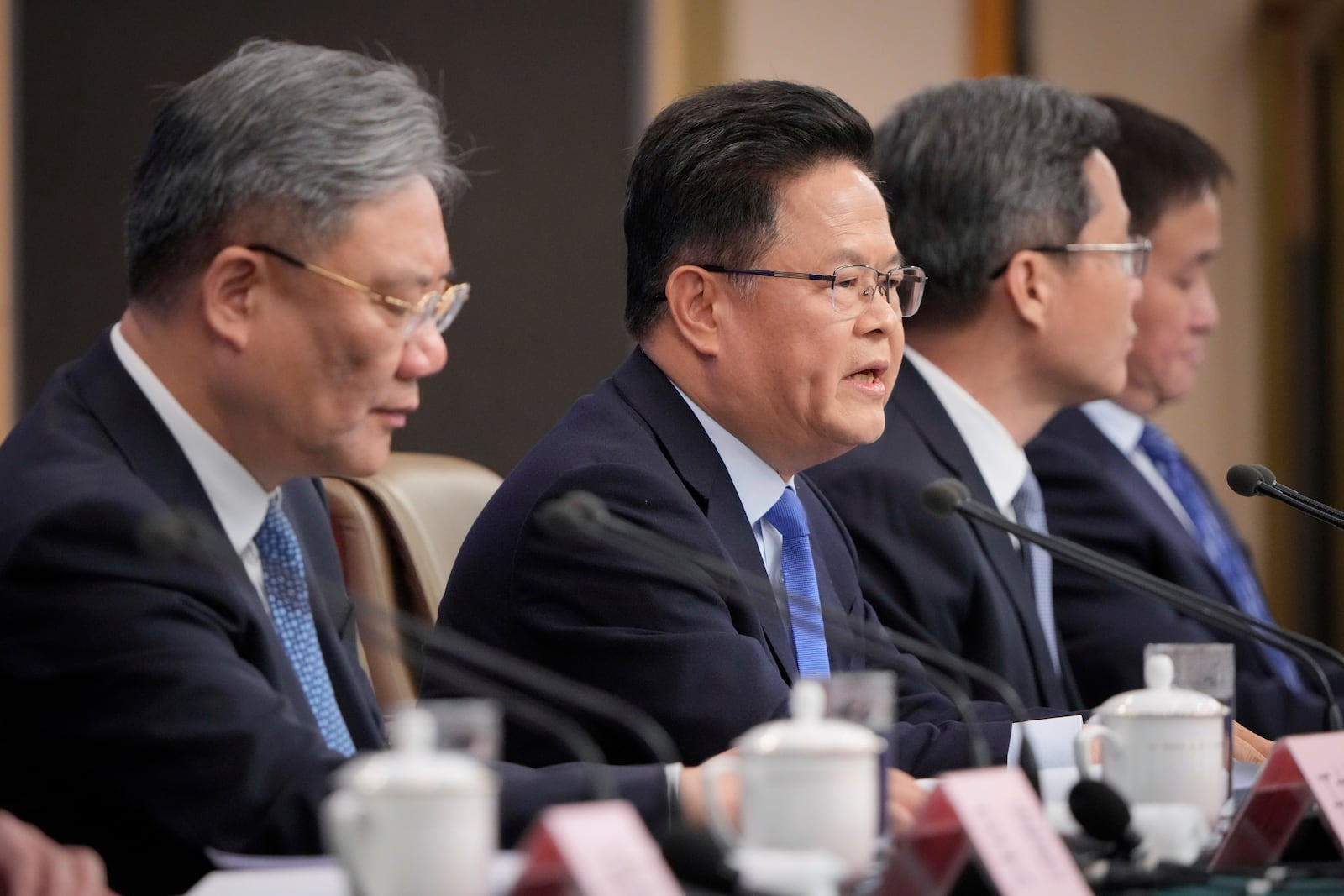 Zheng Shanjie, second from left, chairman of the National Development and Reform Commission meets the press on the sideline of the National People's Congress in Beijing, China, Thursday, March 6, 2025. (AP Photo/Vincent Thian)