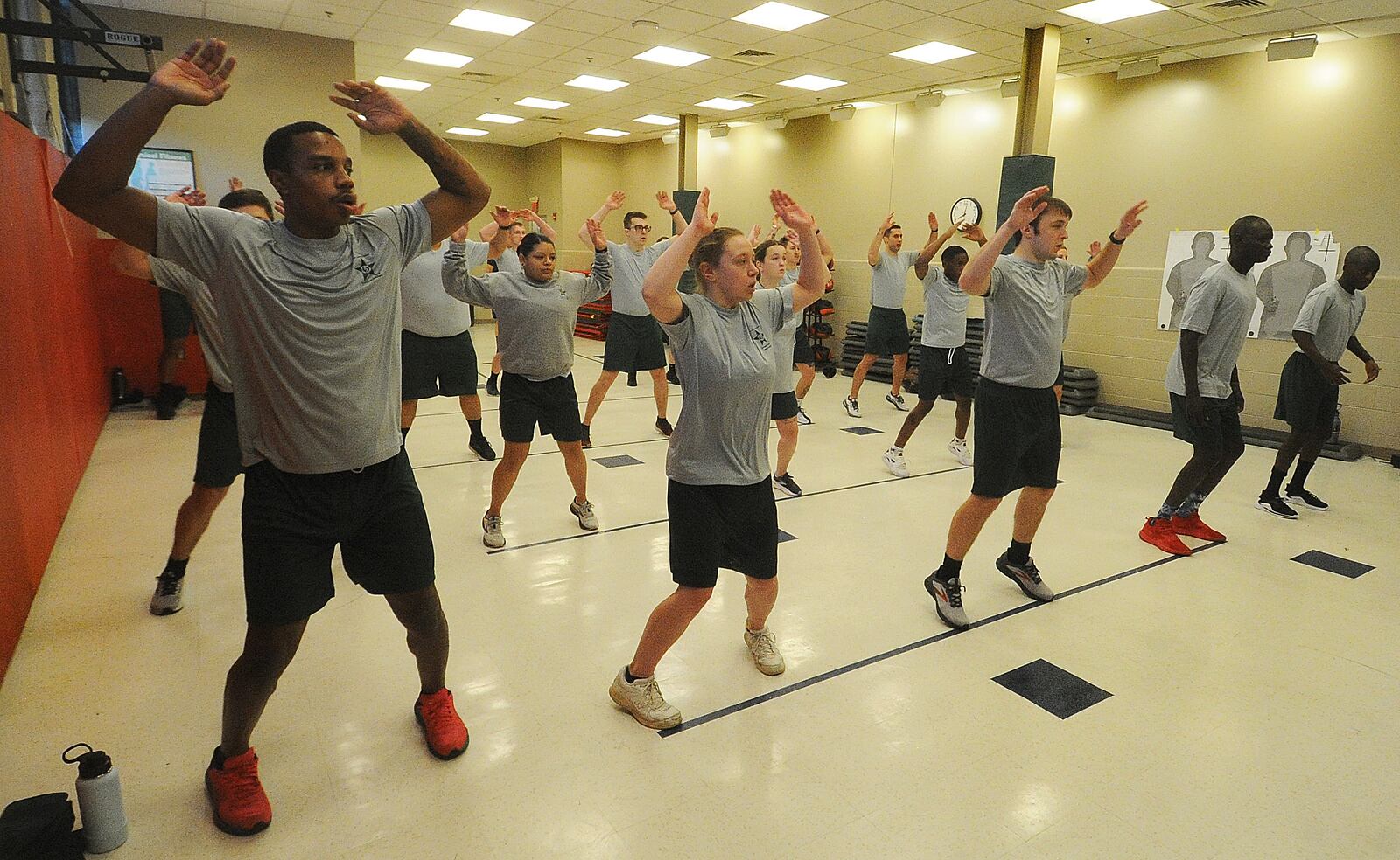 The class of 19 cadets at Sinclair Police Academy performs jumping jacks as part of morning physical training, Thursday, Jan. 11, 2024. MARSHALL GORBY\STAFF