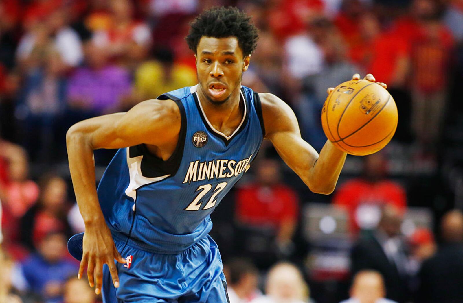 HOUSTON, TX - MARCH 18:  Andrew Wiggins #22 of the Minnesota Timberwolves takes the basketball up the court during their game against the Houston Rockets at the Toyota Center on March 18, 2016 in Houston, Texas.  NOTE TO USER: User expressly acknowledges and agrees that, by downloading and or using this Photograph, user is consenting to the terms and conditions of the Getty Images License Agreement.  (Photo by Scott Halleran/Getty Images)