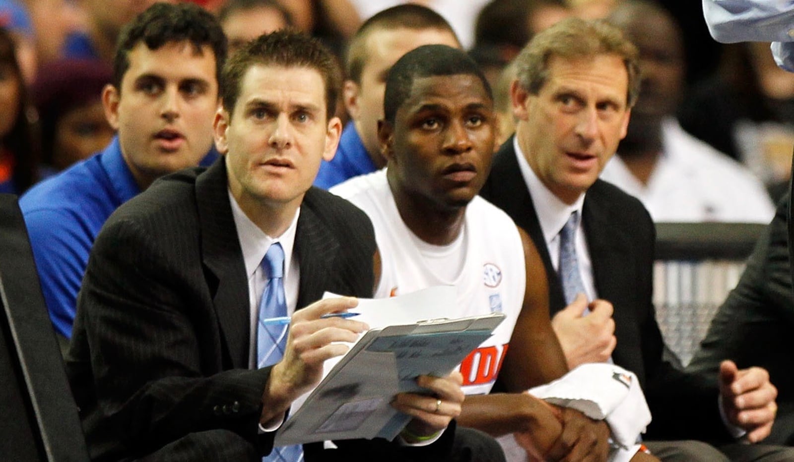 Darren Hertz, left, watches from the Florida bench during the semifinals of the SEC Men's Basketball Tournament at the eorgia Dome on March 12, 2011 in Atlanta, Georgia.