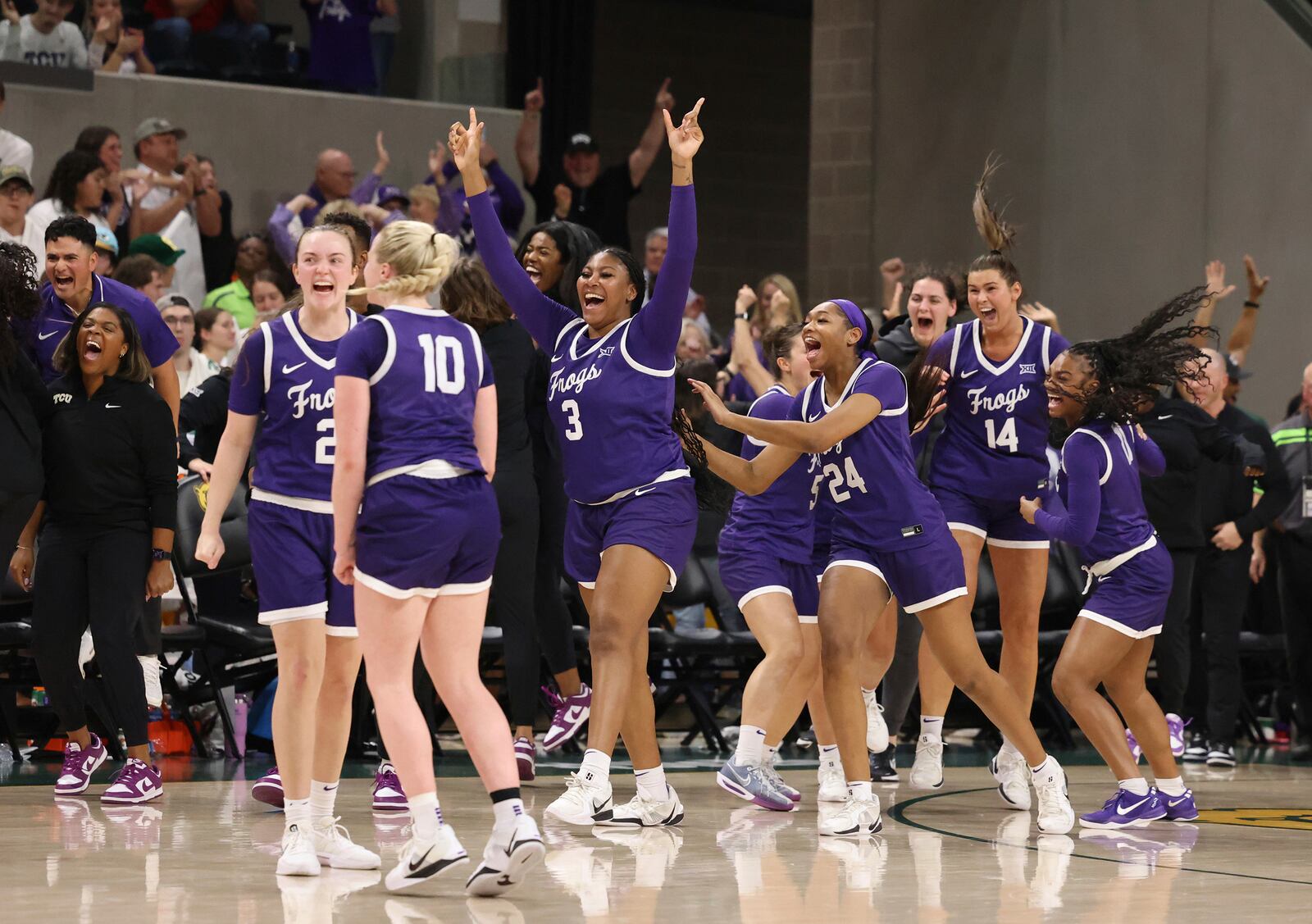 TCU players run on the court after defeating Baylor following an NCAA college basketball game, Sunday, March 2, 2025, in Waco, Texas. (Rod Aydelotte/Waco Tribune-Herald via AP)