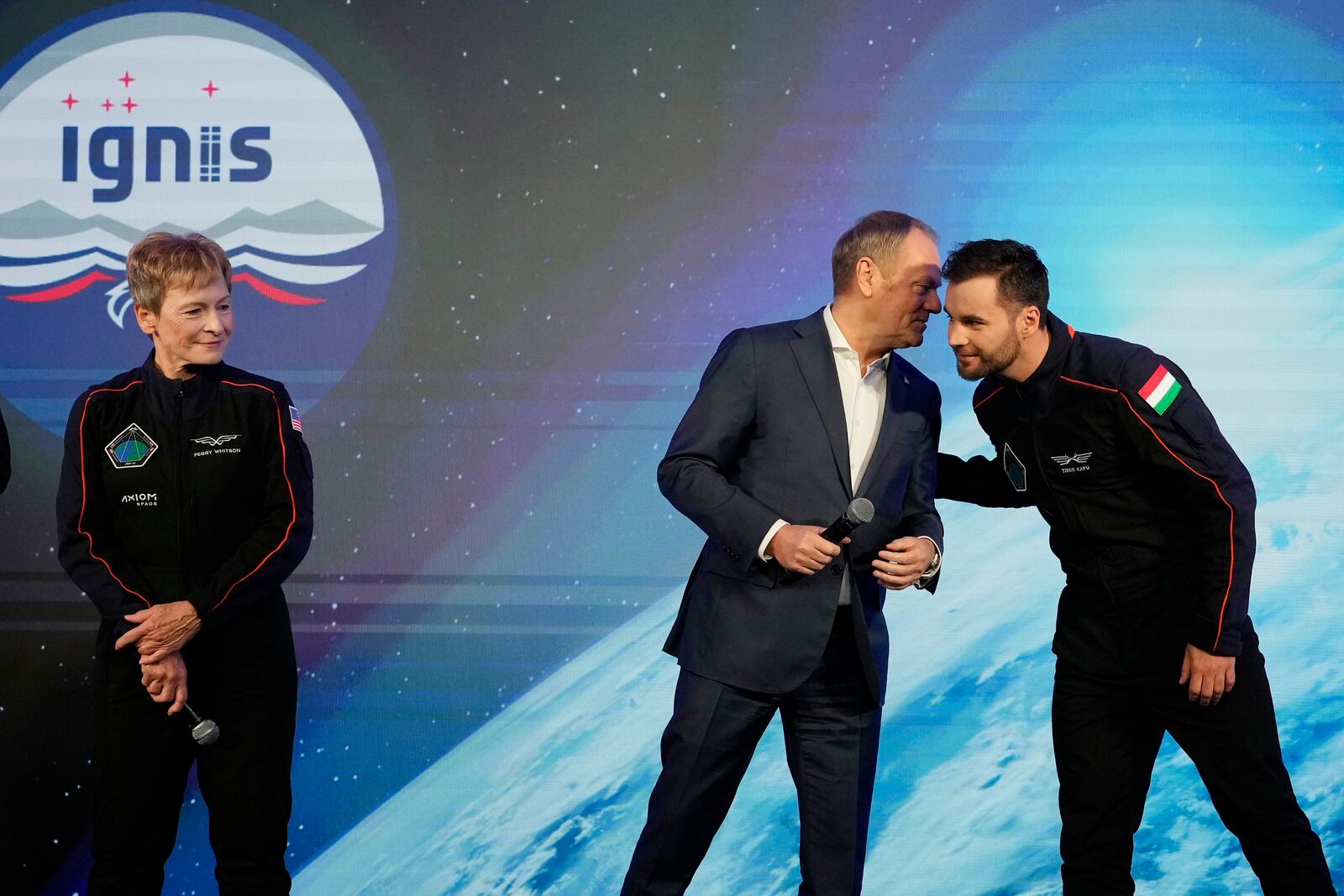 U.S. astronaut Peggy Whitson, left, commander of the Ax-4 scientific space mission with crew members Polish Prime Minister Donald Tusk, center, and Tibor Kapu of Hungary during a media event to talk about their preparations, at the Copernicus Science Center in Warsaw, Poland, Wednesday, Feb. 5, 2025. (AP Photo/Czarek Sokolowski)