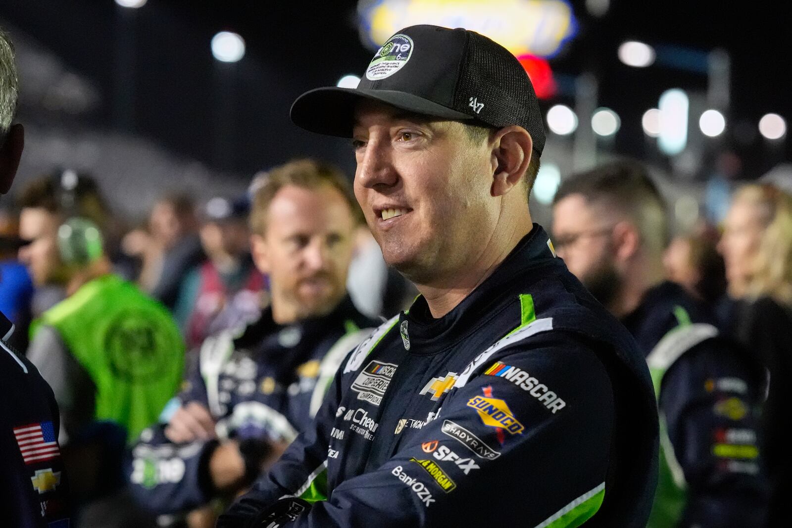 Kyle Busch waits by his car before the start of the first of two NASCAR Daytona 500 qualifying auto races at Daytona International Speedway, Thursday, Feb. 13, 2025, in Daytona Beach, Fla. (AP Photo/John Raoux)