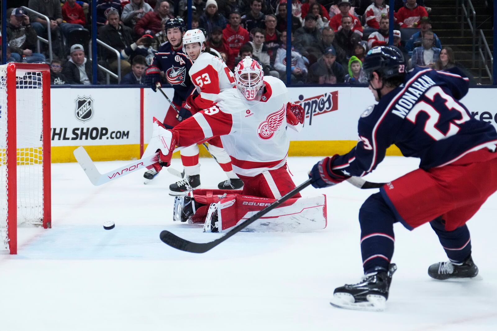 Columbus Blue Jackets center Sean Monahan (23) scores past Detroit Red Wings goaltender Cam Talbot in the second period of an NHL hockey game in Columbus, Ohio, Thursday, Jan. 2, 2025. (AP Photo/Sue Ogrocki)