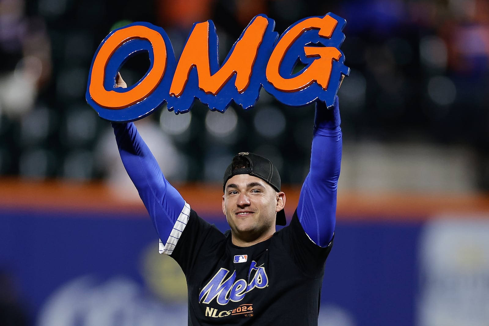 FILE - New York Mets second baseman Jose Iglesias celebrates on the field after the Mets beat the Philadelphia Phillies in Game 4 of the National League baseball playoff series, Oct. 9, 2024, in New York. (AP Photo/Adam Hunger, File)