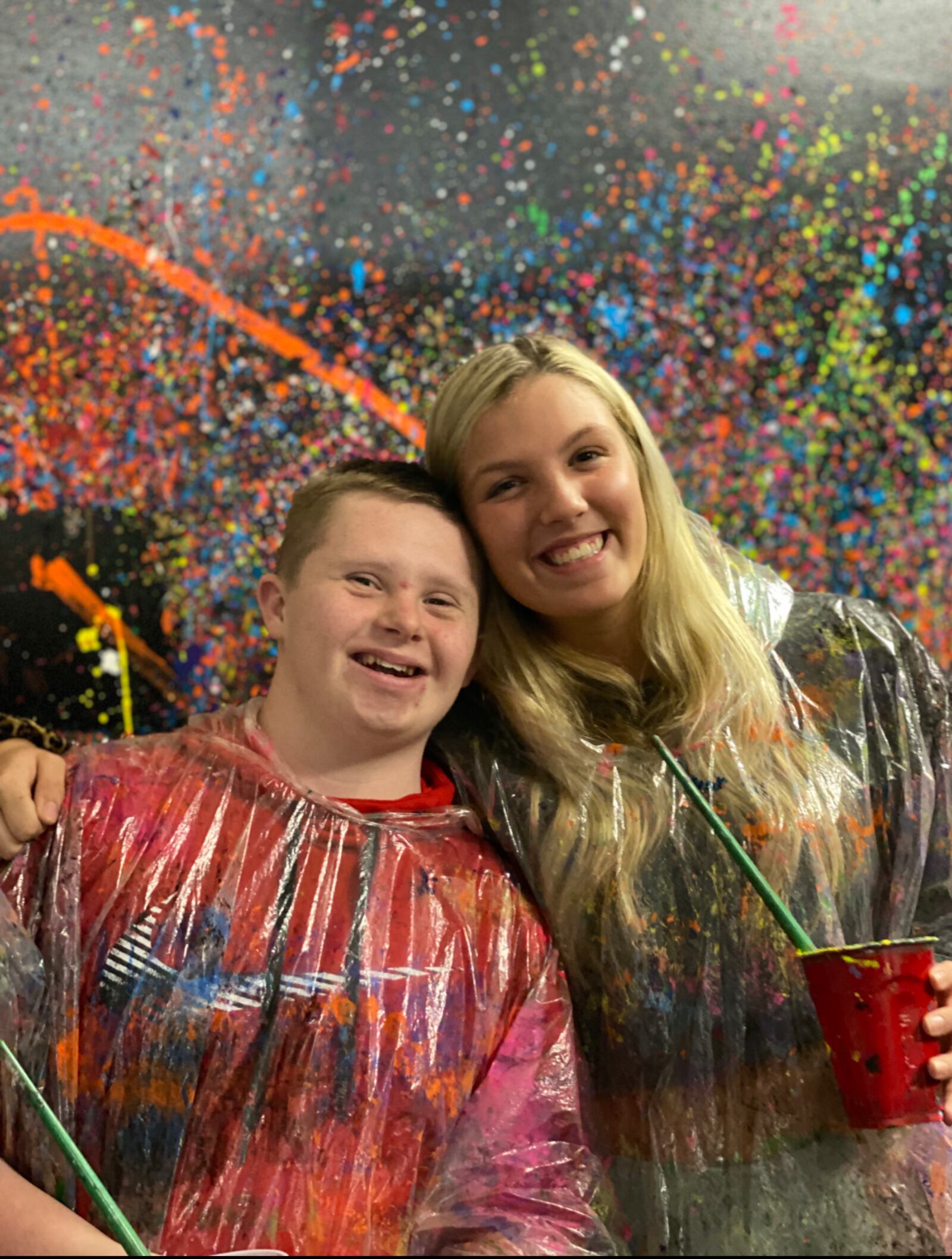 Andy Turner and his best buddy, Olivia Taylor, having fun together at an event in the Splatter Room in Cincinnati. The pair met as freshmen through the Miamisburg Best Buddies program and have formed a lasting friendship. CONTRIBUTED