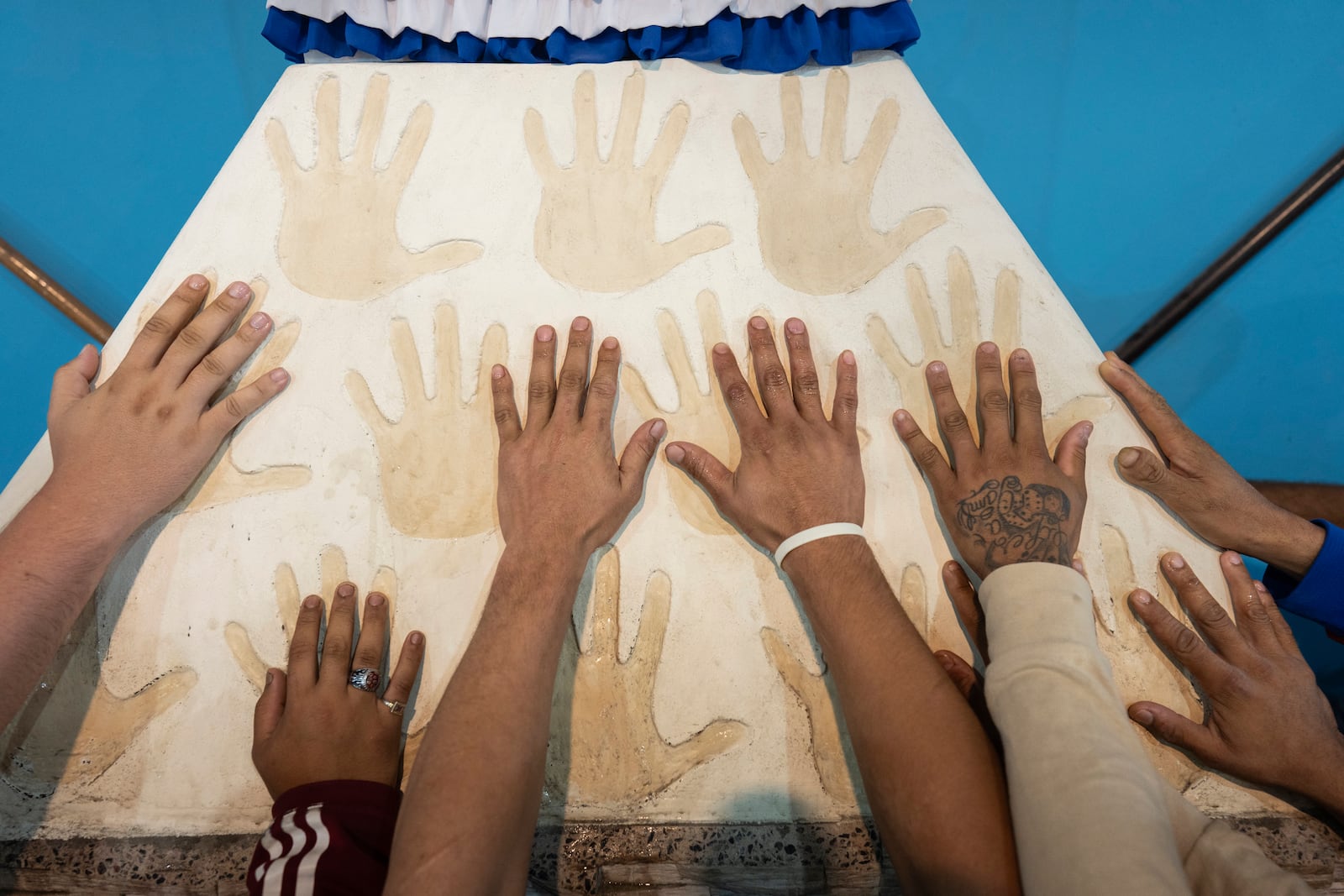 Faithful greet the Virgin of Caacupe during a Mass to pray for Pope Francis' health in Buenos Aires, Argentina, Tuesday, Feb. 18, 2025. (AP Photo/Rodrigo Abd)