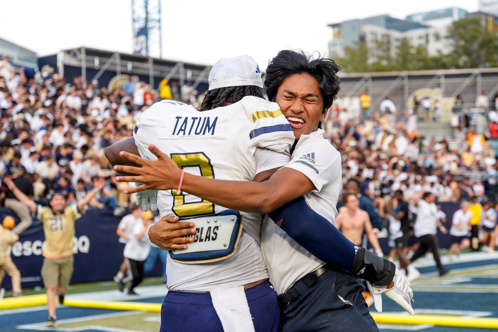 Georgia Tech linebacker Trenilyas Tatum (0) is hugged by a fan after an an NCAA college football game against Miami, Saturday, Nov. 9, 2024, in Atlanta. (AP Photo/Jason Allen)