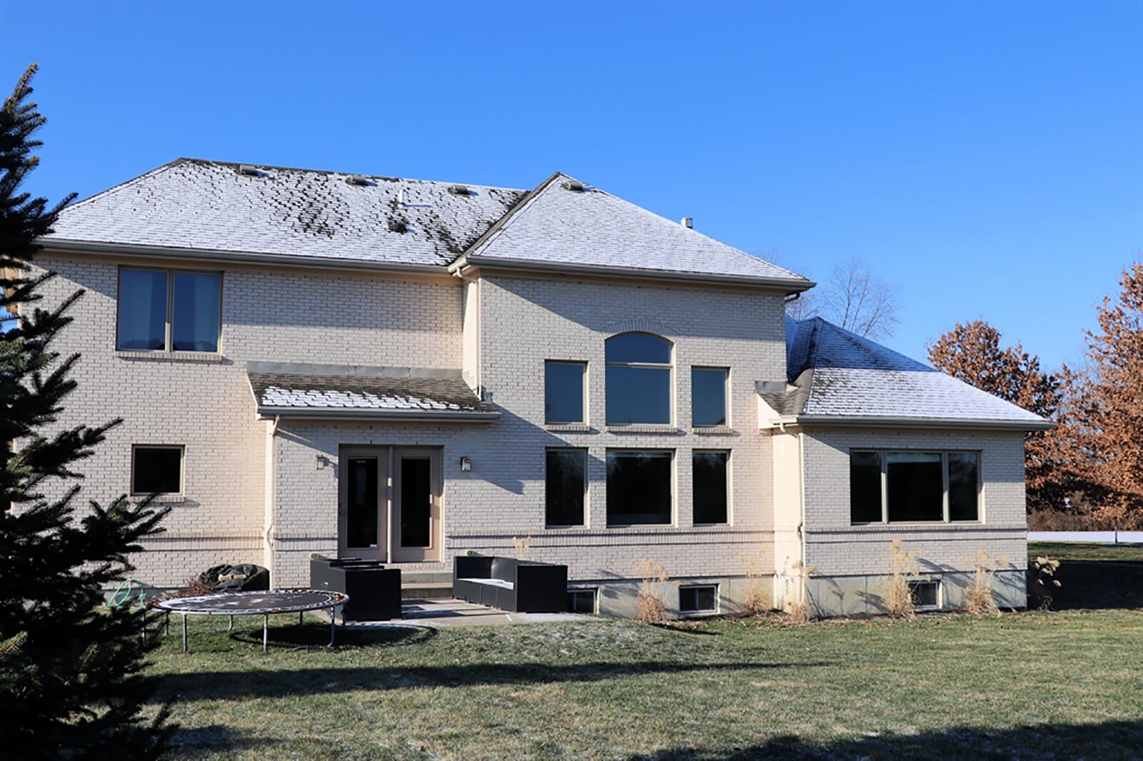 The home has a 3-car garage with extra parking pad and a backyard patio. The house is built above grade so that the basement windows are above ground. CONTRIBUTED PHOTO BY KATHY TYLER