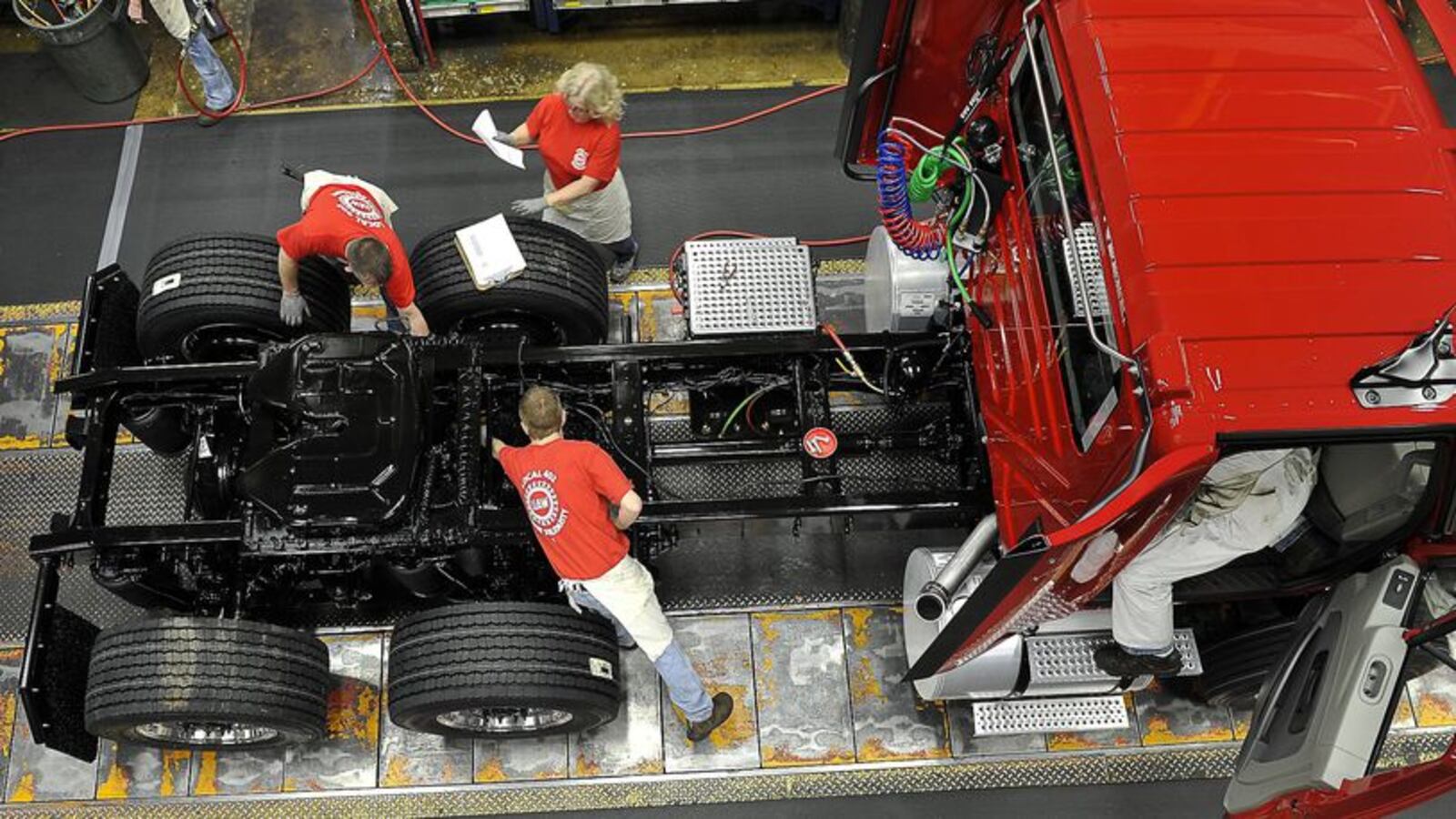 Navistar employees build a truck on the assembly line at the Springfield plant in 2017. 