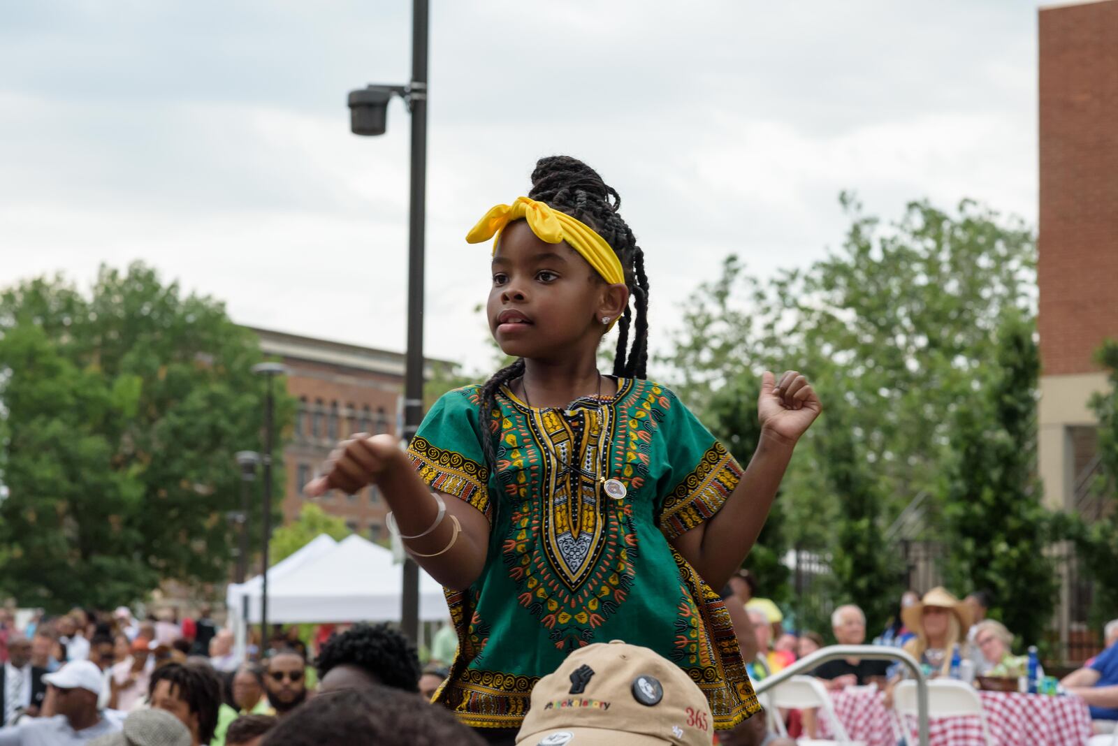 A young patron enjoys the Juneteenth Commemoration, Celebration and Community Concert at Levitt Pavilion in downtown Dayton on Saturday, June 19, 2021. TOM GILLIAM / CONTRIBUTING PHOTOGRAPHER