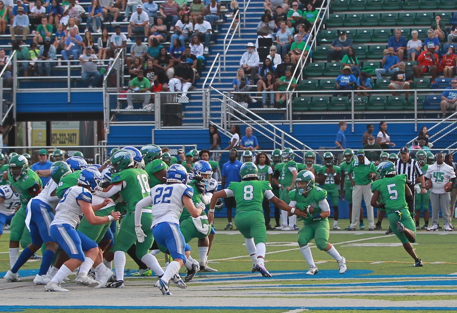 Chaminade Julienne QB Jaiven Manley handes off to Malachi Maddox-Ringer in a high school football game Aug. 23, 2024