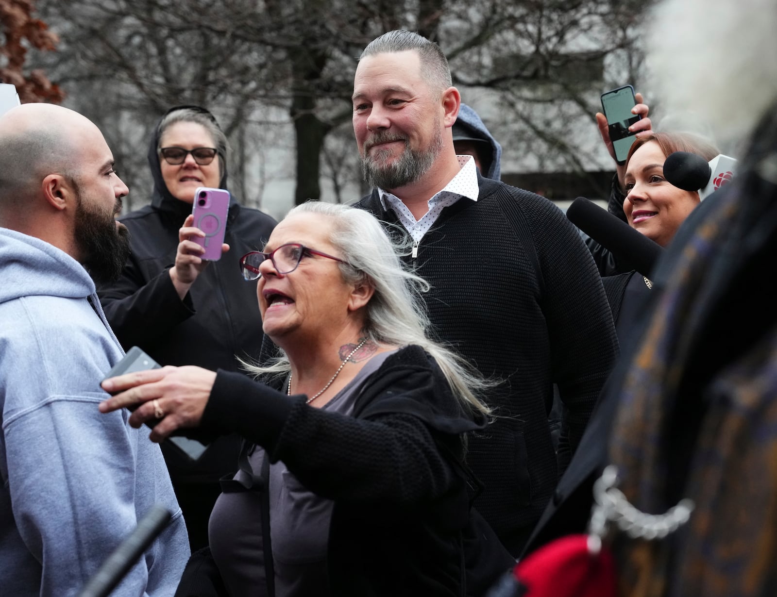 Pat King, top center, a prominent figure in Canada’s trucker protests against COVID-19 restrictions in 2022, is surrounded by supporters as he leaves court in Ottawa, Ontario, Friday, Nov. 22, 2024. (Sean Kilpatrick/The Canadian Press via AP)