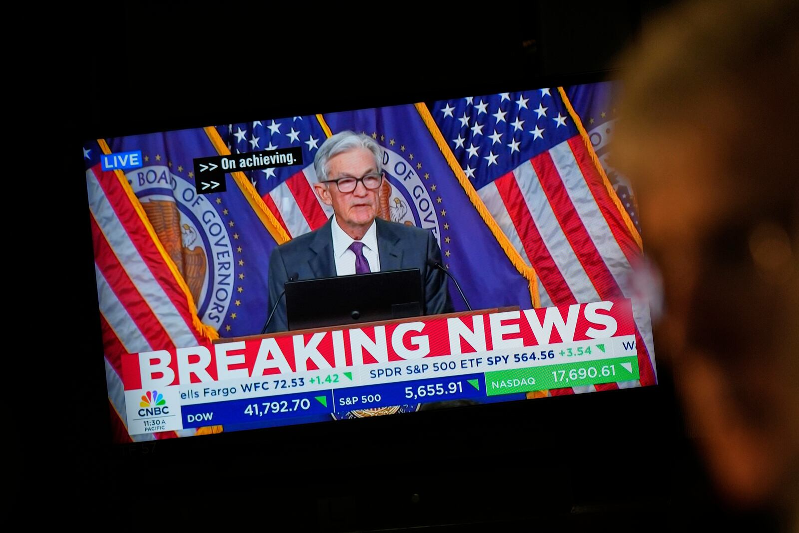 A news conference by Federal Reserve Chair Jerome Powell is displayed on the floor of the New York Stock Exchange in New York, Wednesday, March 19, 2025. (AP Photo/Seth Wenig)