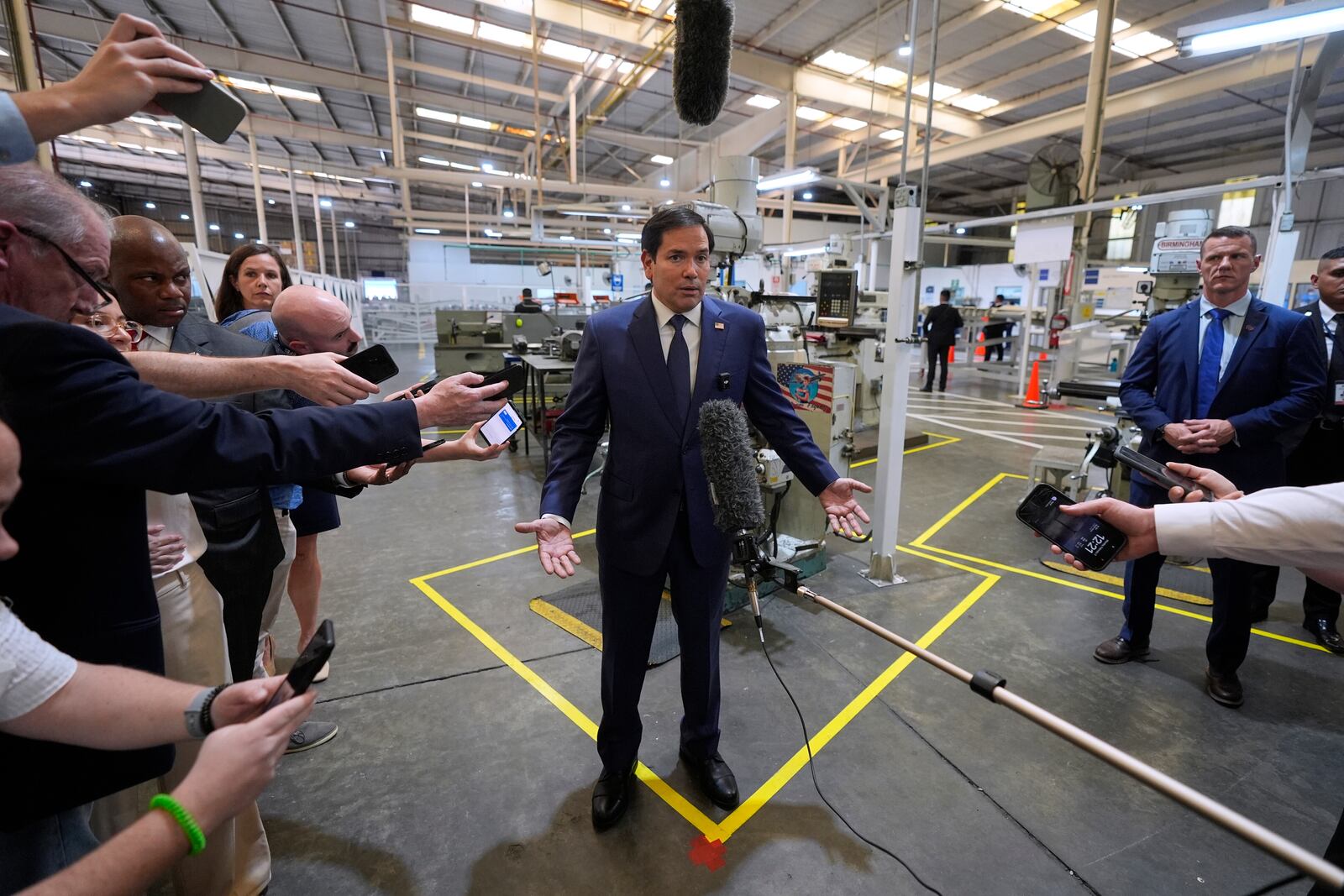 U.S. Secretary of State Marco Rubio speaks to the media during a visit to the aircraft maintenance firm Aeroman in San Luis Talpa, El Salvador, Monday, Feb. 3, 2025. (AP Photo/Mark Schiefelbein, Pool)