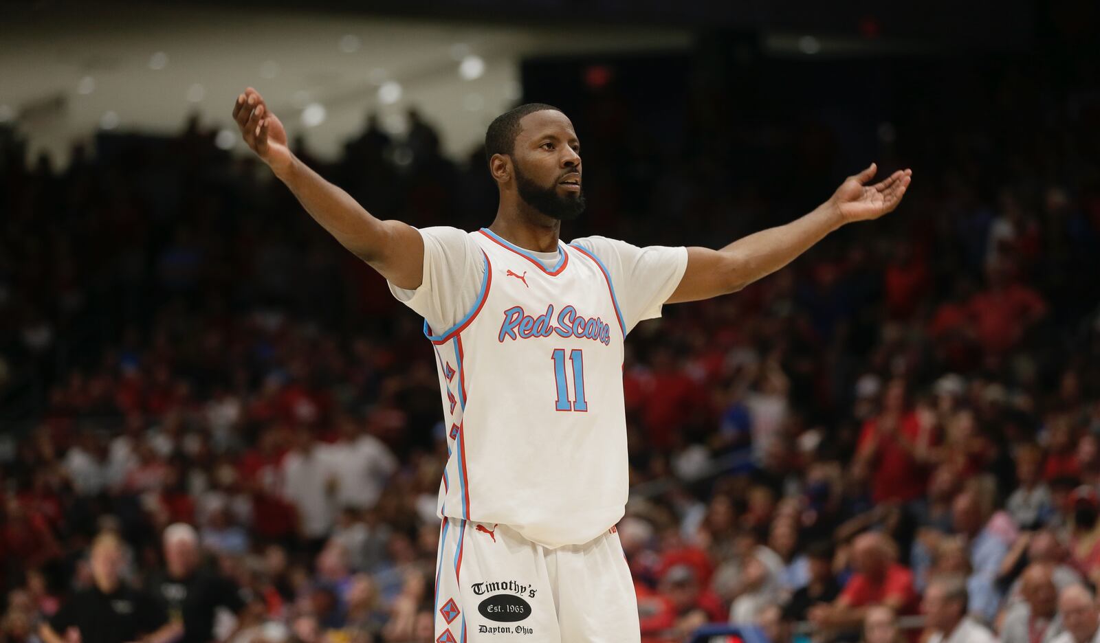 The Red Scare's Scoochie Smith pumps up the crowd during a game against Best Virginia in the quarterfinals of The Basketball Tournament on Friday, July 29, 2022, at UD Arena. David Jablonski/Staff