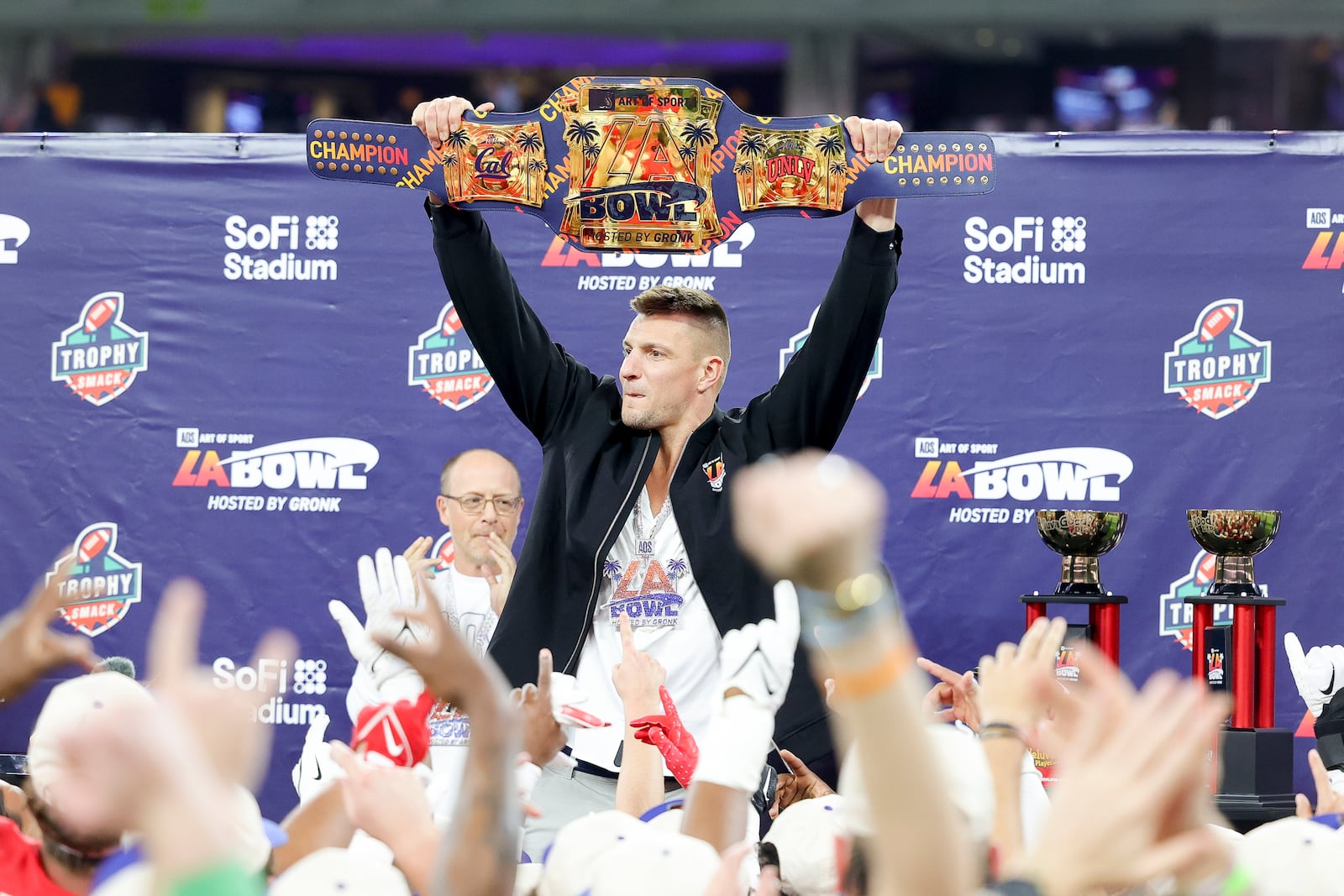 Former NFL tight end Rob Gronkowski holds up the LA Bowl belt after UNLV's victory over California during the LA Bowl NCAA college football game Wednesday, Dec. 18, 2024, in Inglewood, Calif. (AP Photo/Ryan Sun)