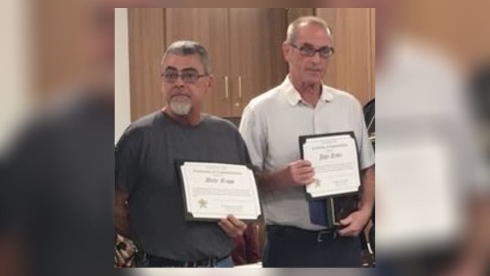 Dale Rapp (left) and John Ryder are considered heroes for their efforts in saving five people from a burning home last November. (Sean Cudahy/Staff)