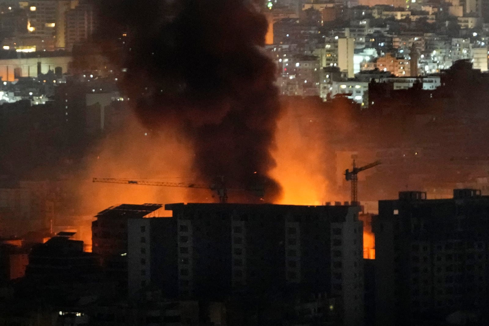 Flame and smoke rises from Israeli airstrikes on Dahiyeh, in the southern suburb of Beirut, Lebanon, early Friday, Nov. 1, 2024. (AP Photo/Hussein Malla)