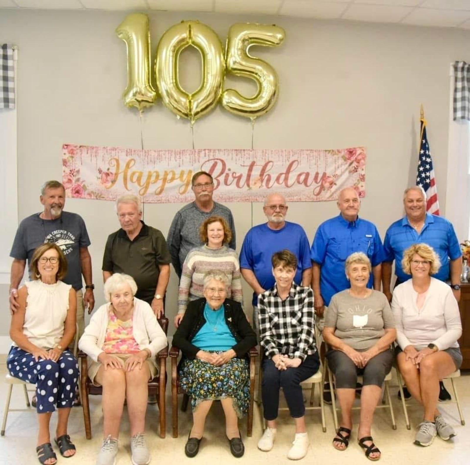 At her 105th birthday celebration last October, Iola Creamer (third from left) was joined by her six children and their spouses: (left to right)  daughter Betheen Struewing with husband Ken behind her; daughter Myrna Smith with husband Ron; son David Creamer with his wife Sandy in front of him; daughter Mary Dye with her husband Mike; daughter Frances Kipp with her husband, Tim; and daughter Lisa Robinson  with her husband Robert. CONTRIBUTED