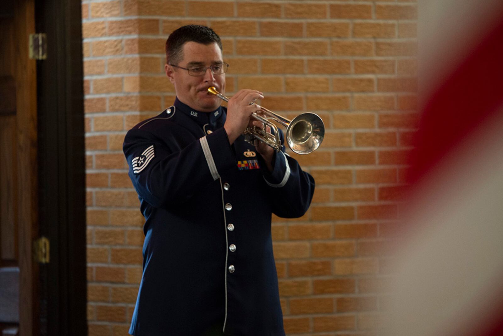 Tech. Sgt. Will McCrary, U.S. Air Force Band of Flight, plays the trumpet during the Anzac Day commemoration at the Prairies Chapel on April 25. U.S. AIR FORCE PHOTO/JAIMA FOGG