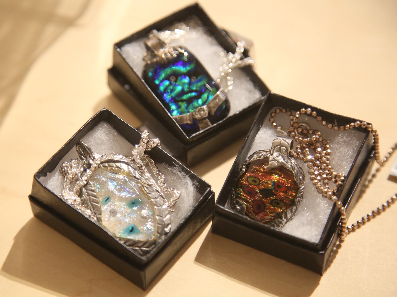 The Contemporary Daytonâs Annual Holiday Gift Gallery begins Nov. 14. More than 70 local and regional artists have created original, fine art pieces perfect for holiday gifts. Colorful pendants are made by Guustie Alvarado. LISA POWELL / STAFF