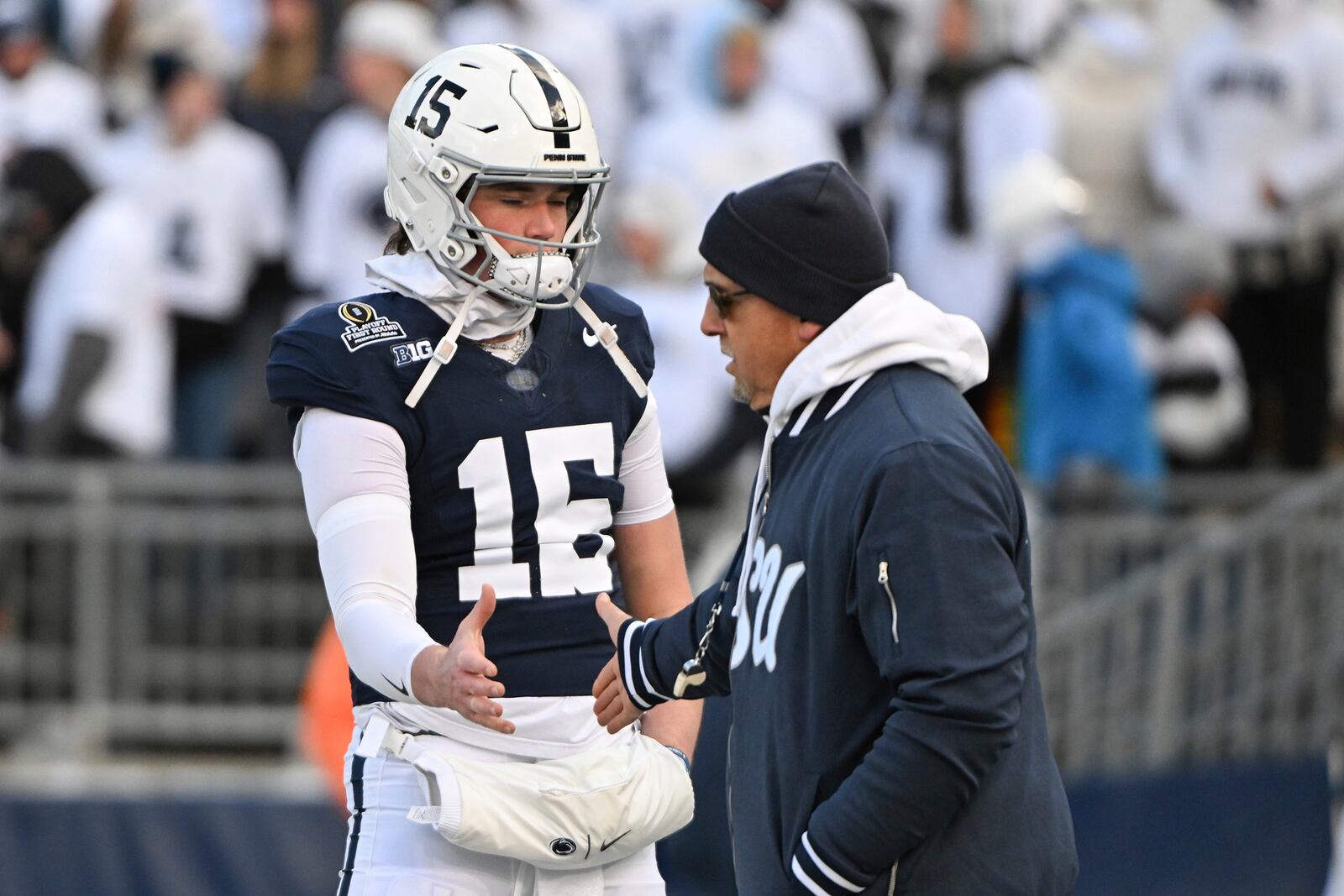 Penn State quarterback Drew Allar greets head coach James Franklin before the game against SMU in the first round of the NCAA College Football Playoff, Saturday, Dec. 21, 2024, in State College, Pa. (AP Photo/Barry Reeger)